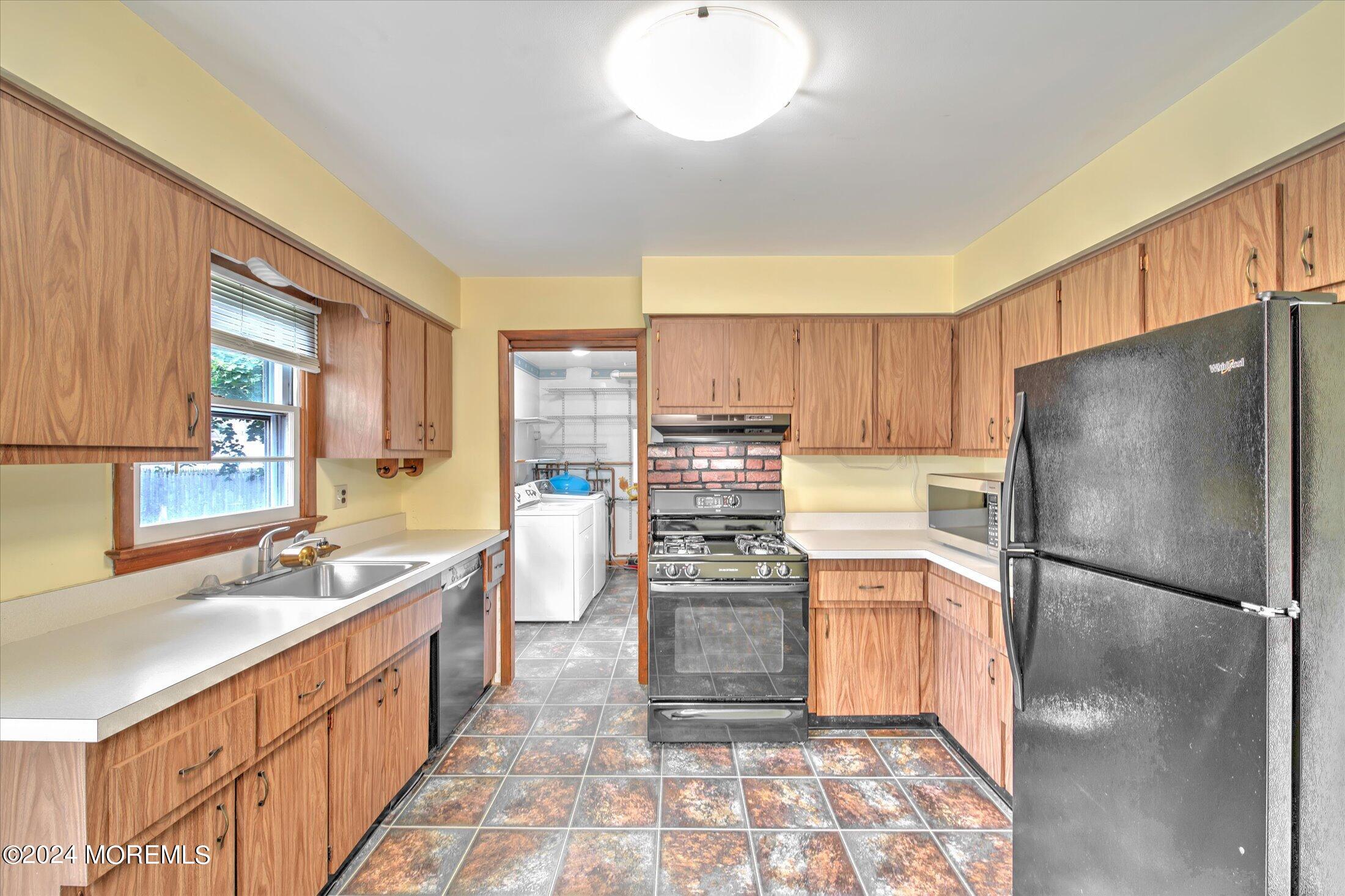 2209 Glen Oak Drive Forked River, NJ 08731 - Photo 14 of 44 a kitchen with stainless steel appliances granite countertop a refrigerator a stove and a sink with cabinets