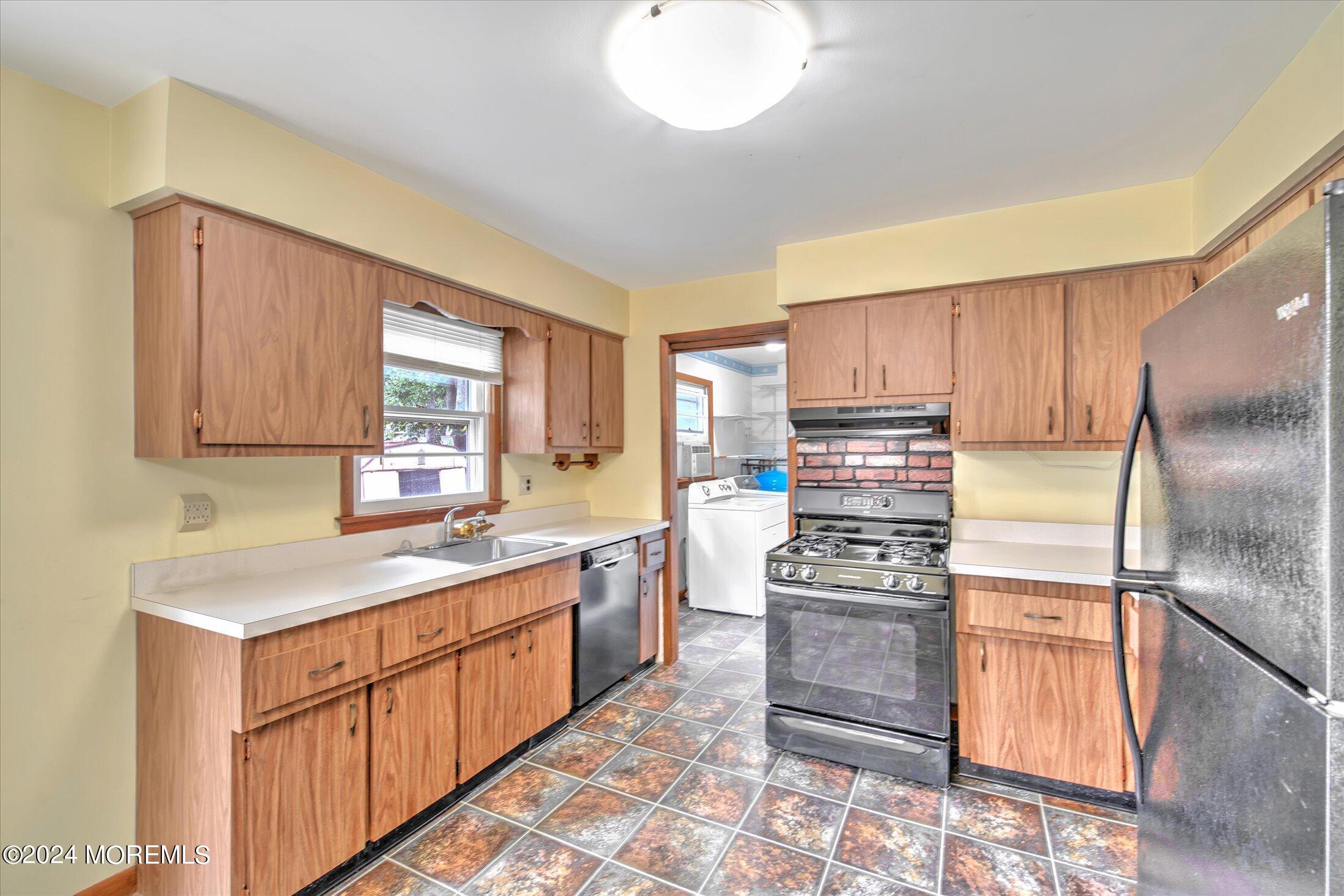 2209 Glen Oak Drive Forked River, NJ 08731 - Photo 15 of 44 a kitchen with stainless steel appliances granite countertop a refrigerator sink and cabinets