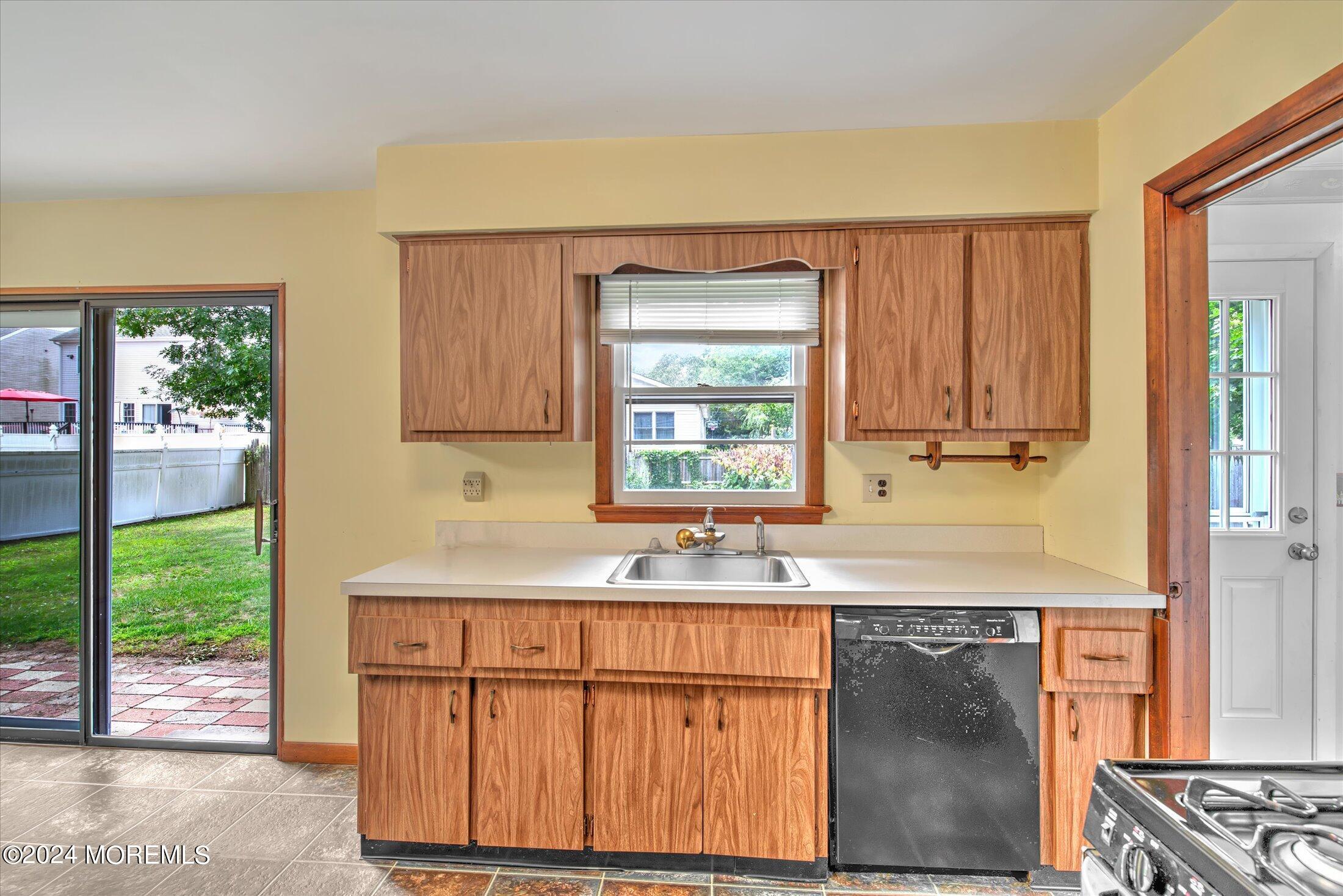 2209 Glen Oak Drive Forked River, NJ 08731 - Photo 16 of 44 a kitchen with granite countertop a sink stainless steel appliances and cabinets