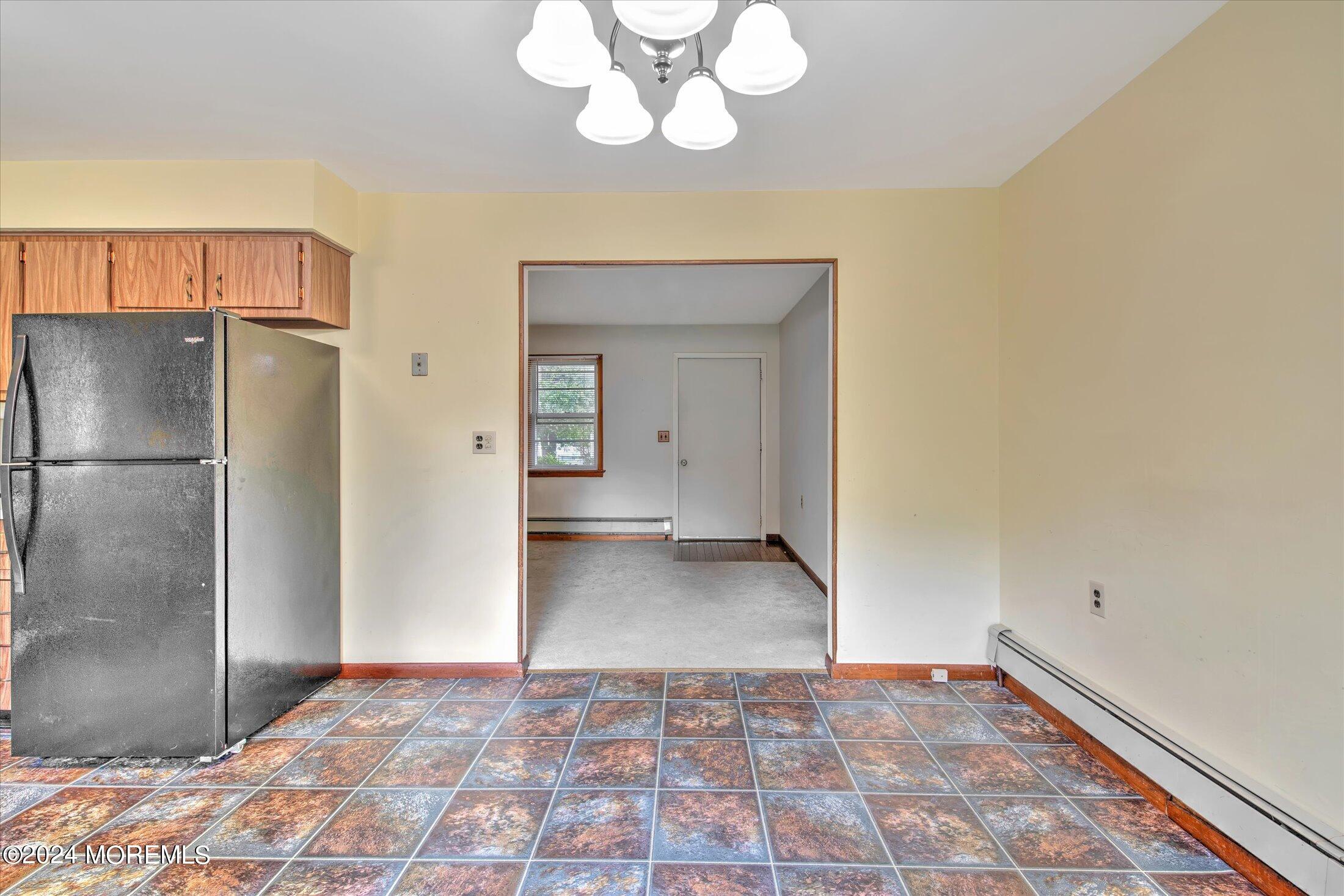 2209 Glen Oak Drive Forked River, NJ 08731 - Photo 19 of 44 a view of a kitchen with a sink and a refrigerator