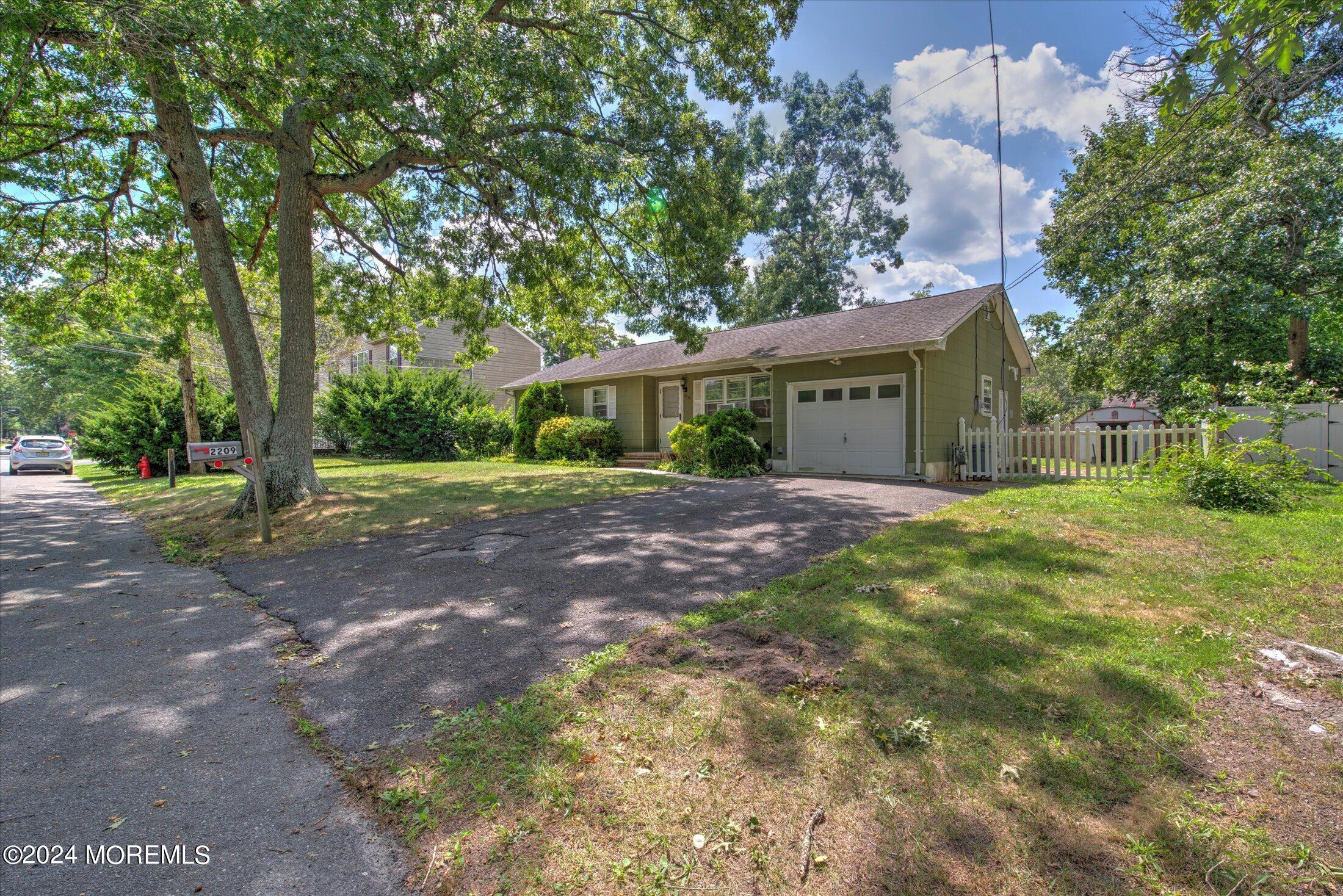 2209 Glen Oak Drive Forked River, NJ 08731 - Photo 2 of 44 a front view of a house with a yard