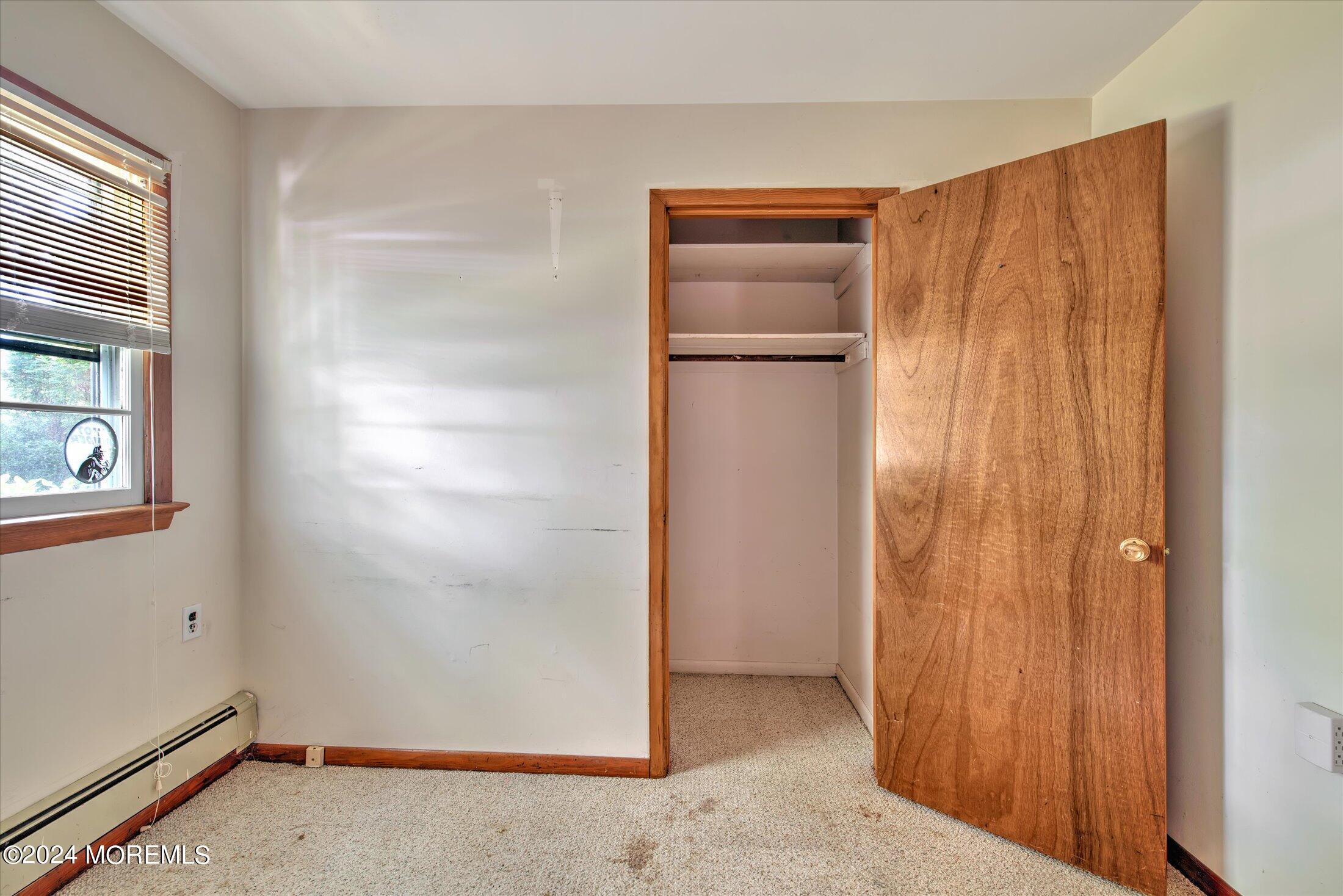 2209 Glen Oak Drive Forked River, NJ 08731 - Photo 31 of 44 an empty room with windows and closet