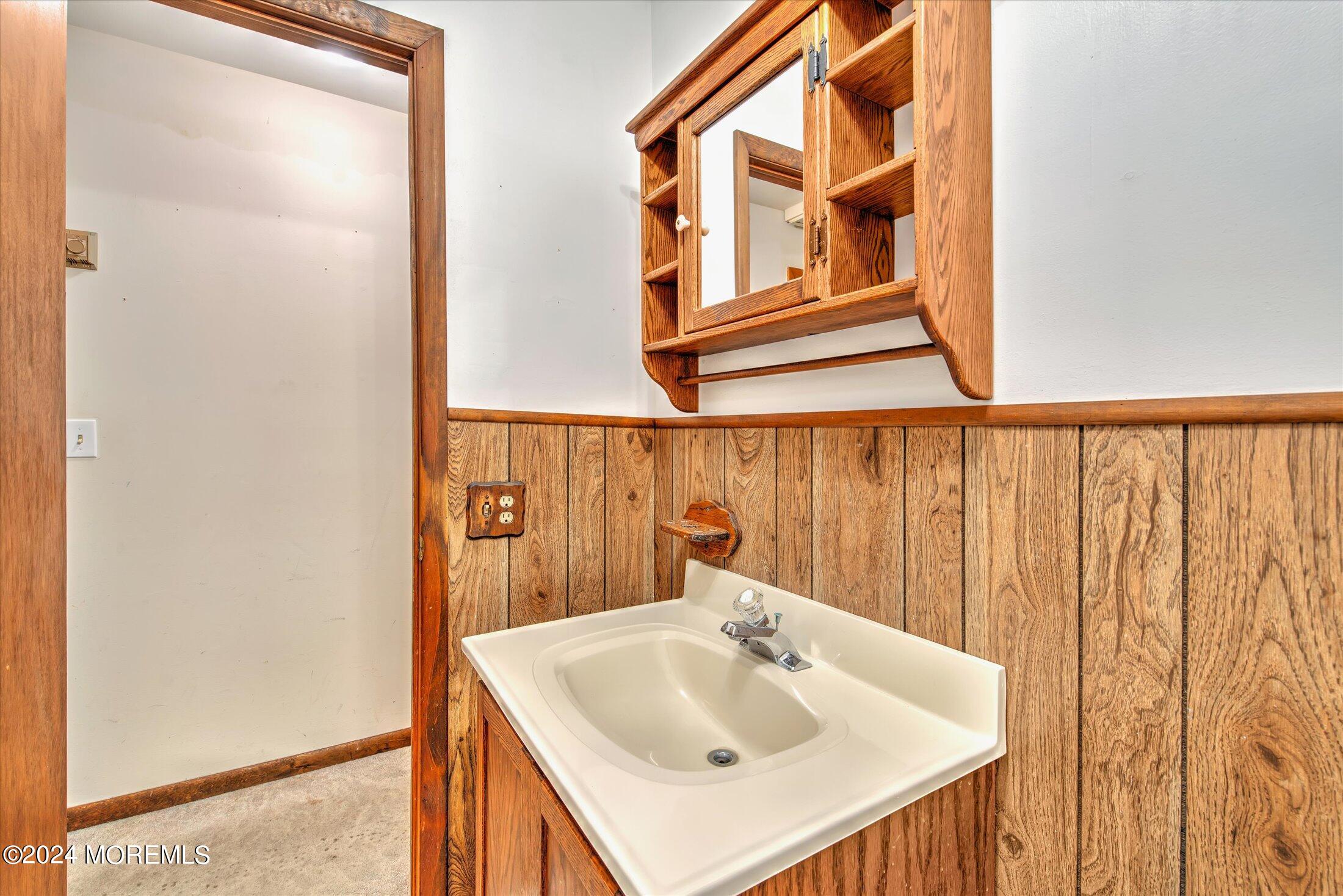 2209 Glen Oak Drive Forked River, NJ 08731 - Photo 33 of 44 a bathroom with a sink and a mirror