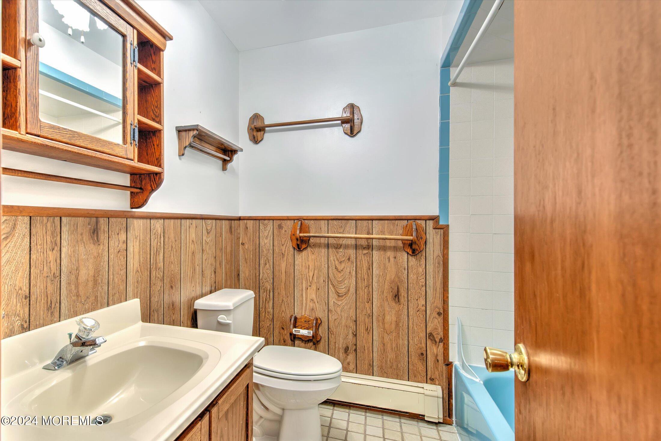 2209 Glen Oak Drive Forked River, NJ 08731 - Photo 34 of 44 a bathroom with a sink a toilet and shower curtain