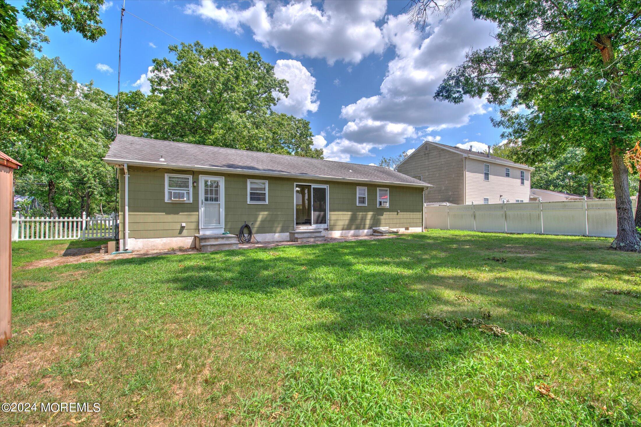 2209 Glen Oak Drive Forked River, NJ 08731 - Photo 39 of 44 a front view of house with yard and green space