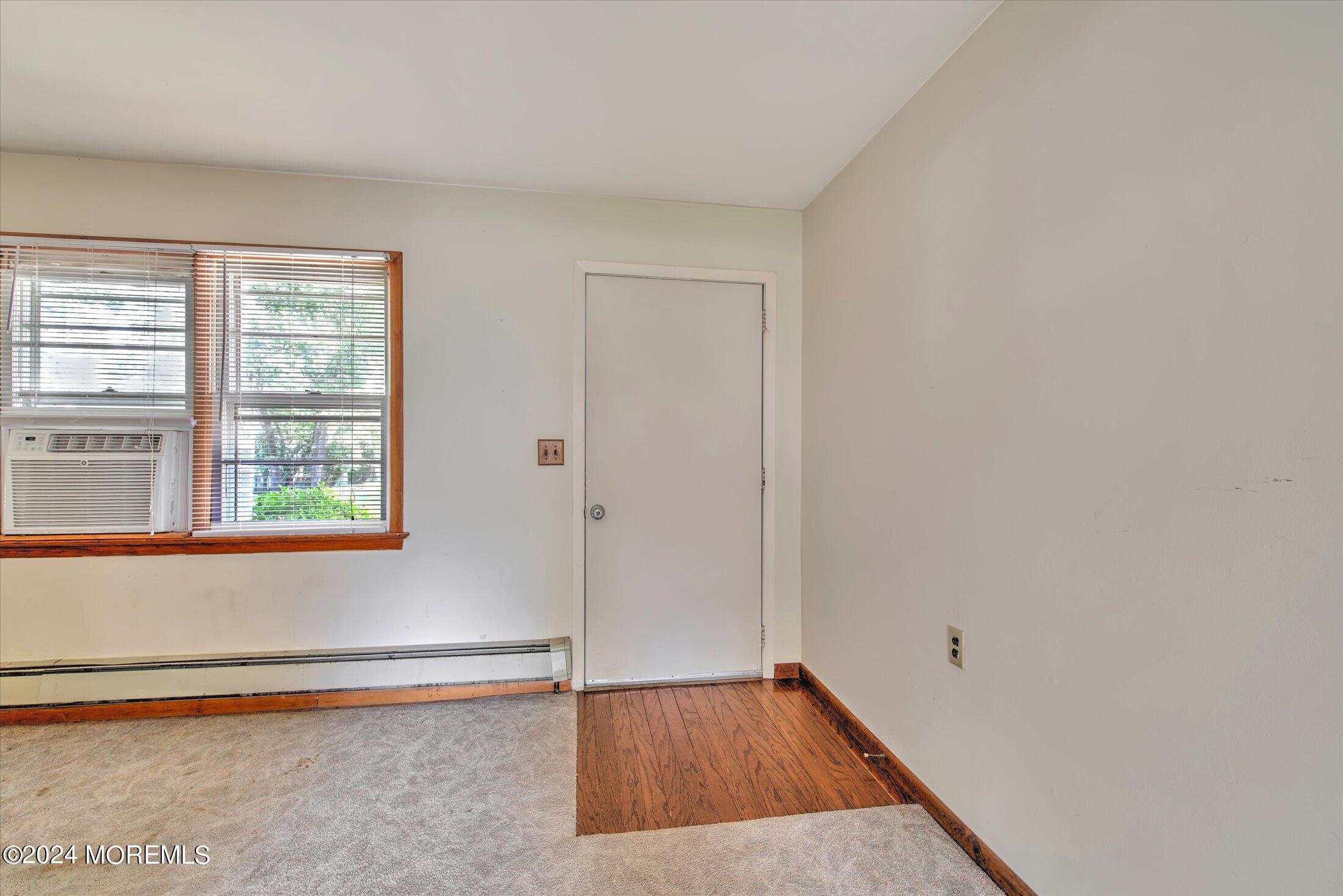 2209 Glen Oak Drive Forked River, NJ 08731 - Photo 4 of 44 an empty room with wooden floor and windows