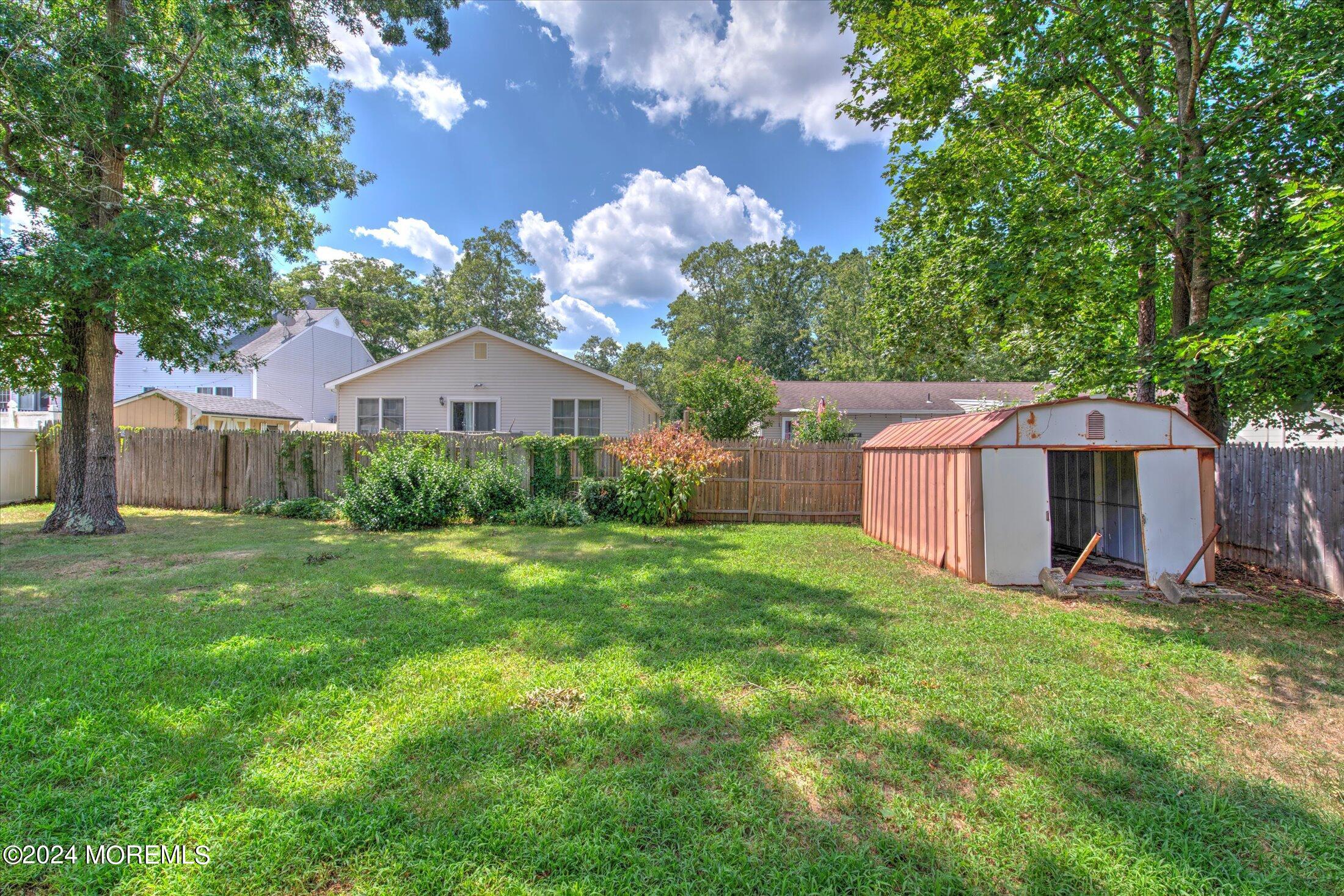 2209 Glen Oak Drive Forked River, NJ 08731 - Photo 42 of 44 a front view of house with yard and trees