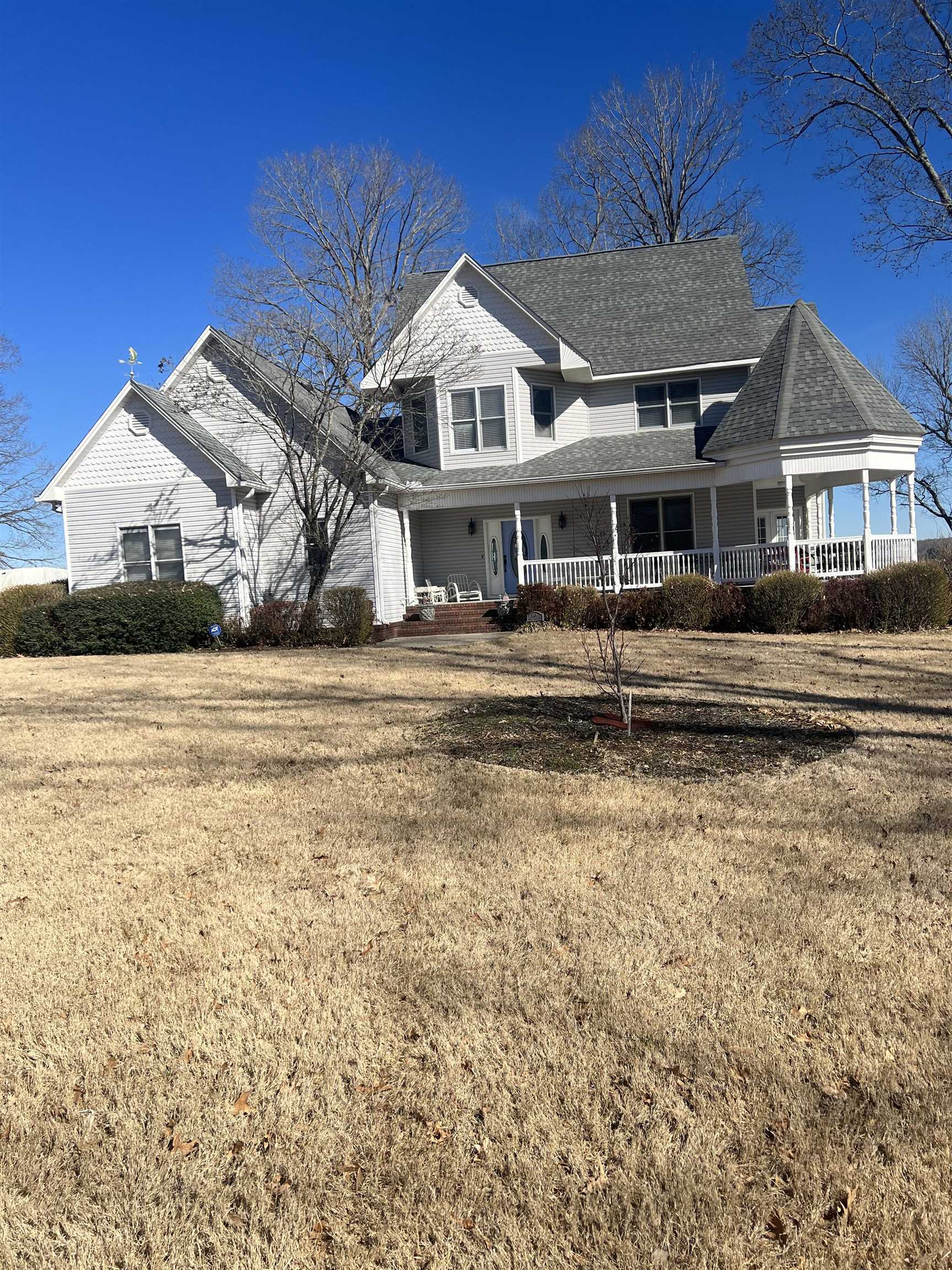 1101 Pride Estates Road Tuscumbia, AL 35674 - Photo 1 of 25 a front view of a house with a garden