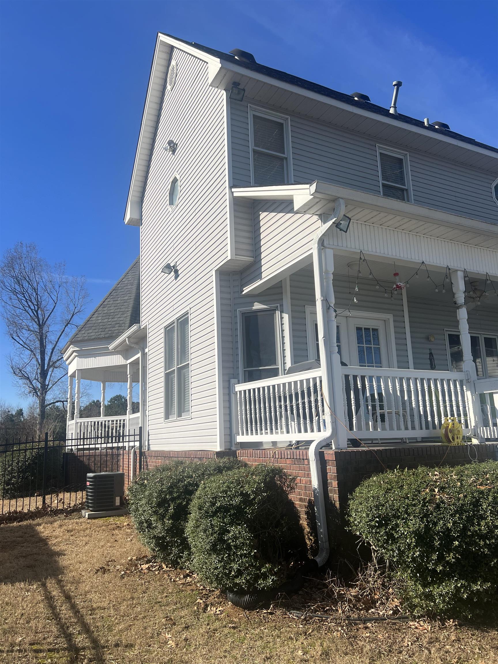 1101 Pride Estates Road Tuscumbia, AL 35674 - Photo 2 of 25 a front view of a house with a garden