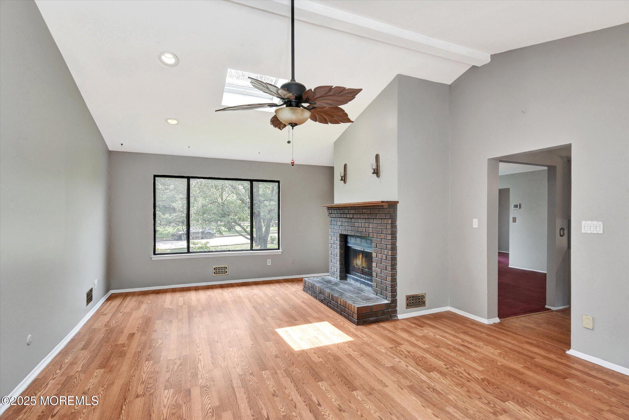 19 Northwoods Road Asbury Park, NJ 07712 - Photo 21 of 79 a view of an empty room with a window and fireplace