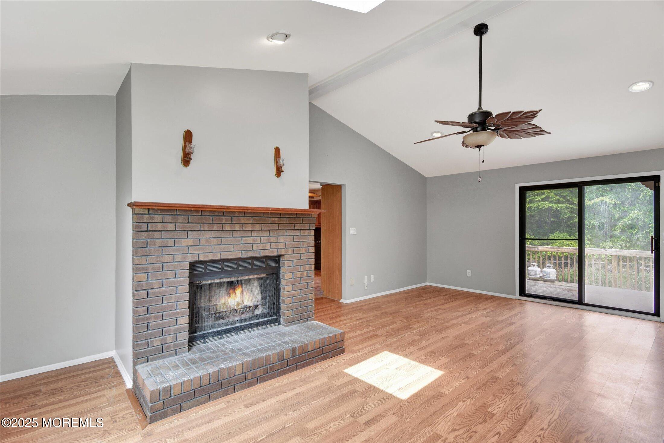19 Northwoods Road Asbury Park, NJ 07712 - Photo 22 of 79 a view of an empty room with a fireplace and a window