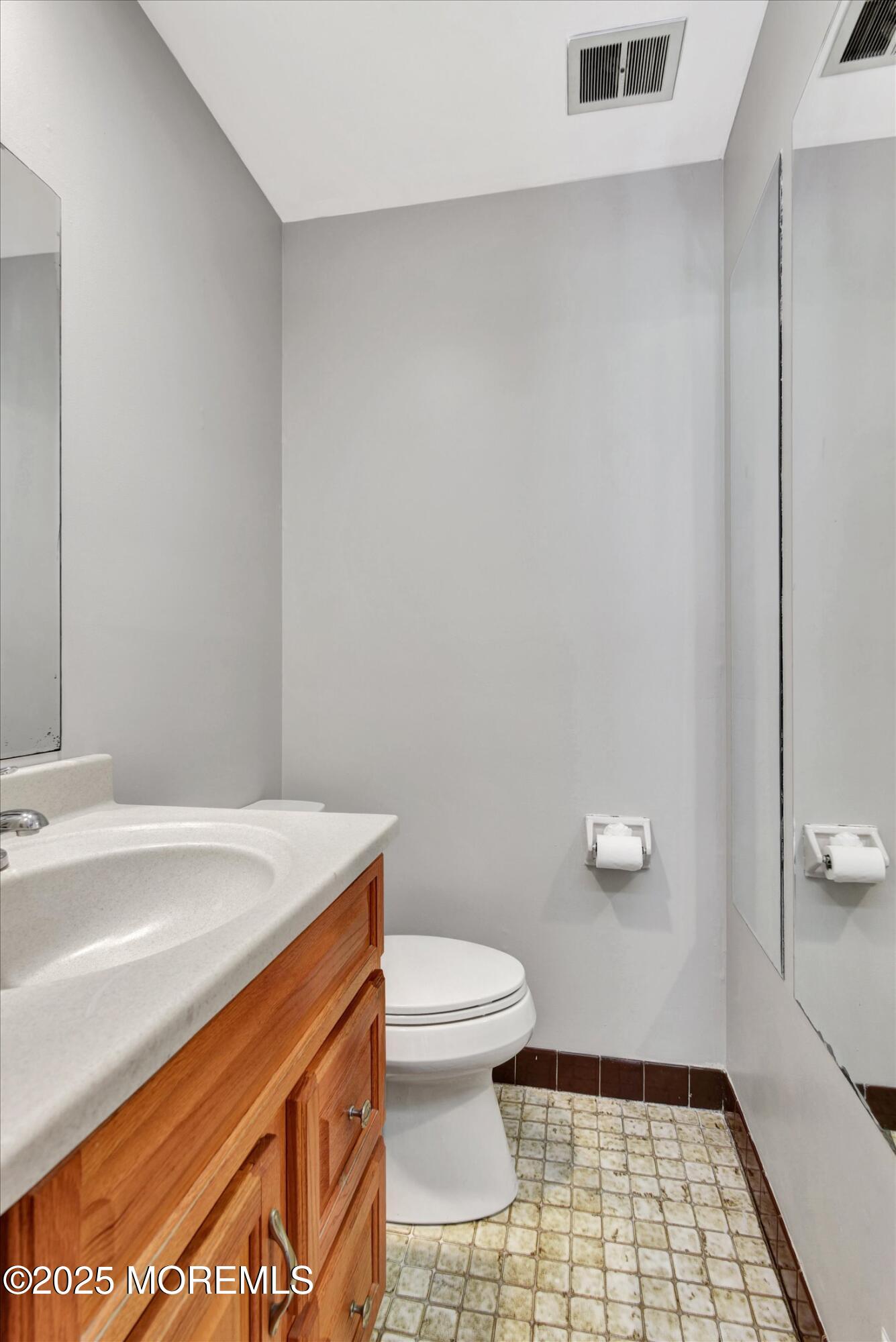 19 Northwoods Road Asbury Park, NJ 07712 - Photo 24 of 79 a bathroom with a sink a toilet and a mirror