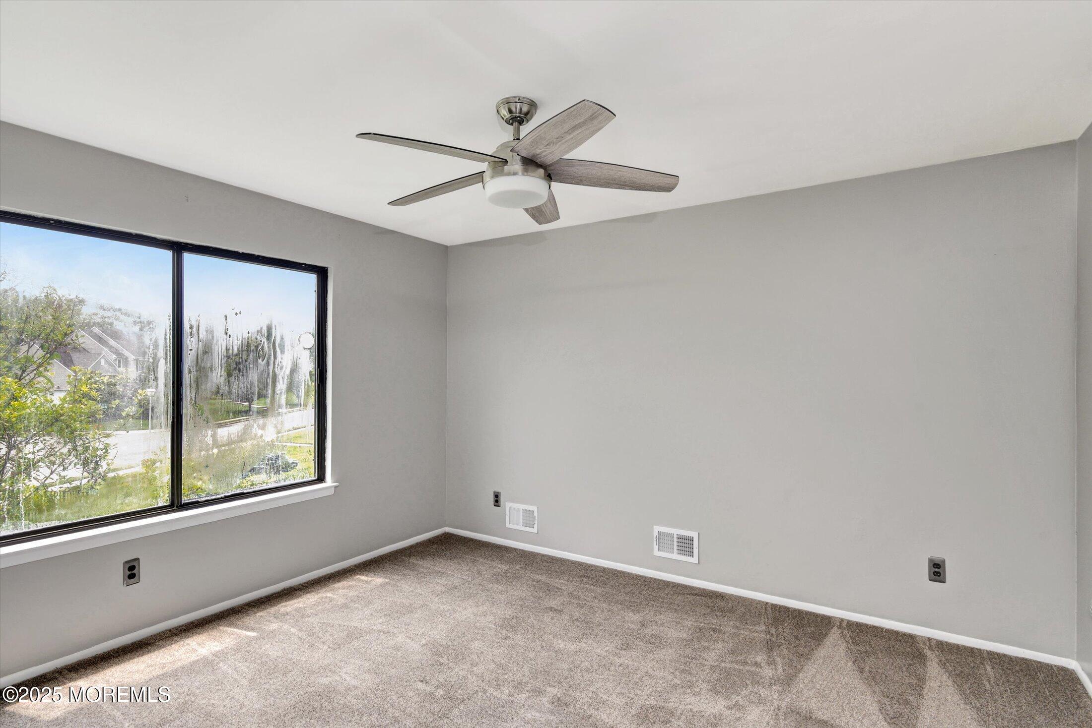 19 Northwoods Road Asbury Park, NJ 07712 - Photo 27 of 79 a view of an empty room with a window