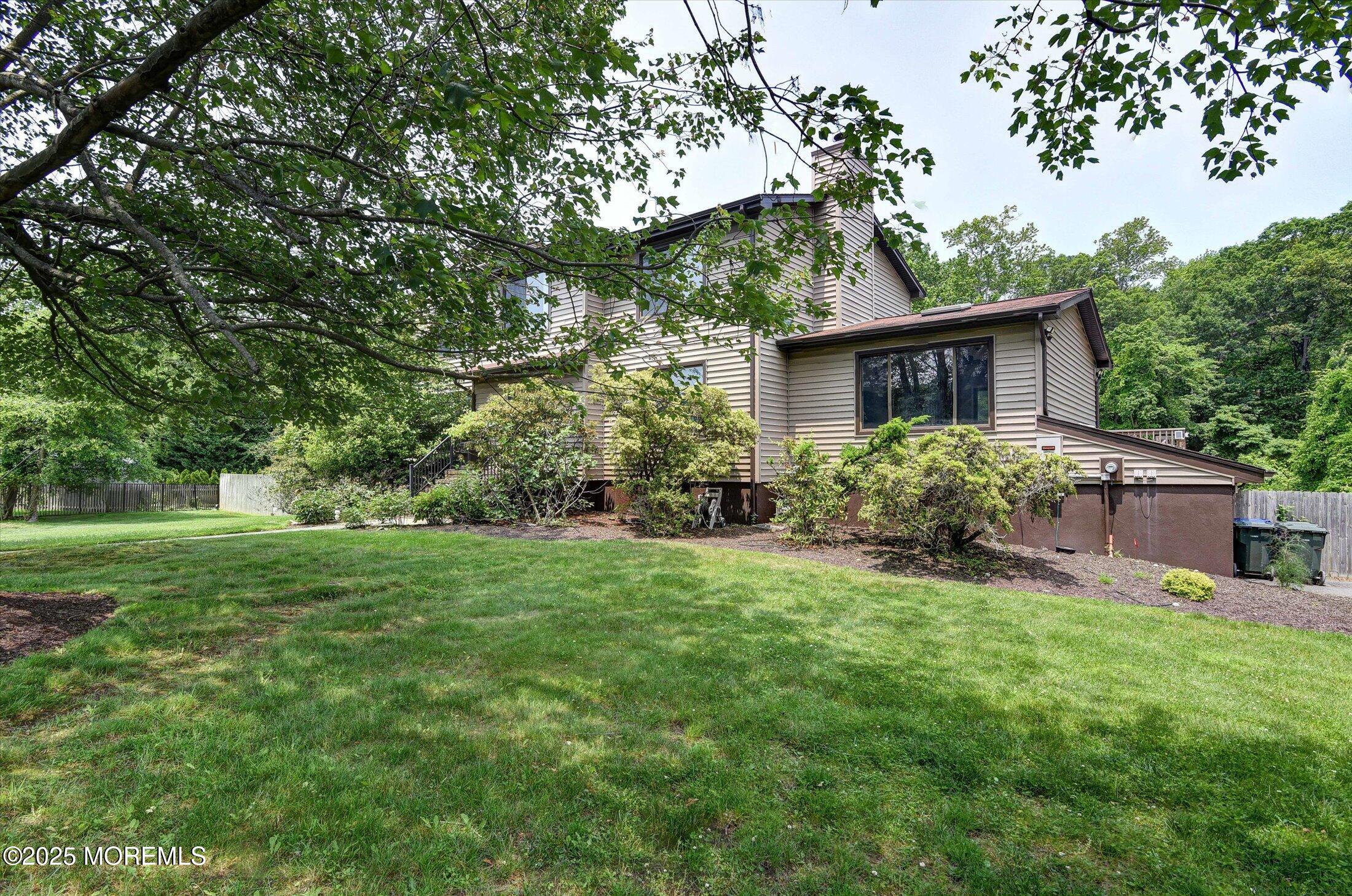 19 Northwoods Road Asbury Park, NJ 07712 - Photo 4 of 79 front view of a house with a yard
