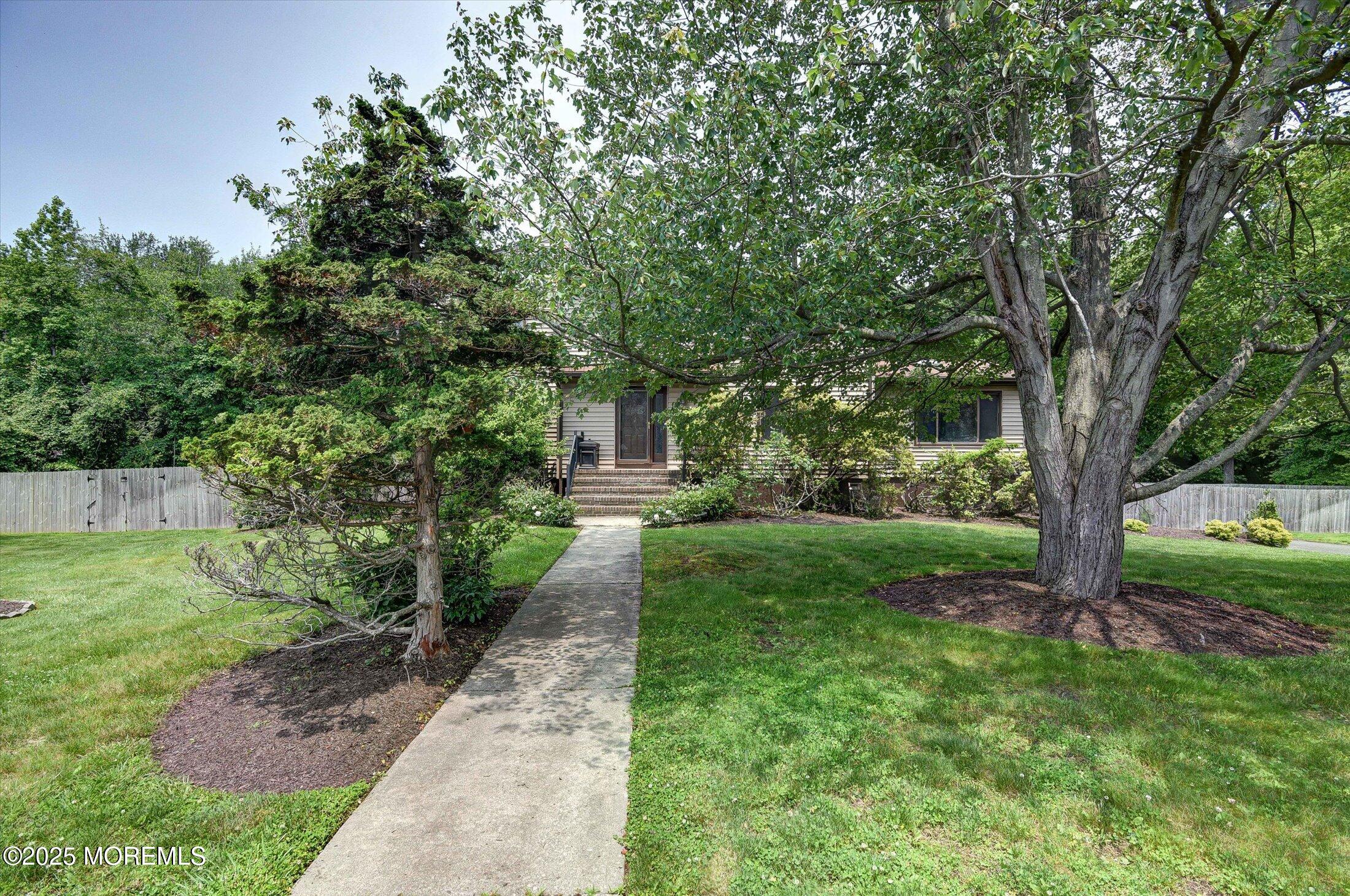 19 Northwoods Road Asbury Park, NJ 07712 - Photo 6 of 79 a view of a garden with a tree
