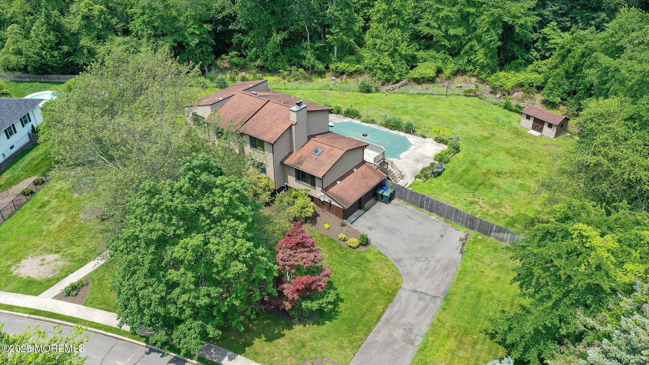 19 Northwoods Road Asbury Park, NJ 07712 - Photo 62 of 79 an aerial view of a house with a garden