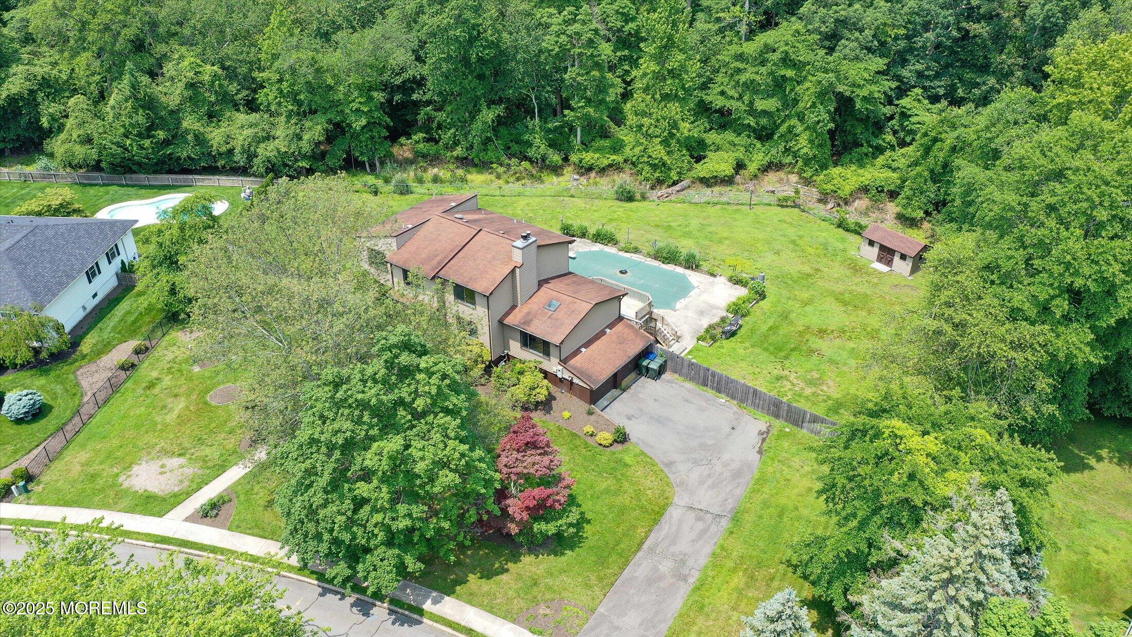 19 Northwoods Road Asbury Park, NJ 07712 - Photo 63 of 79 an aerial view of residential house with outdoor space and trees all around