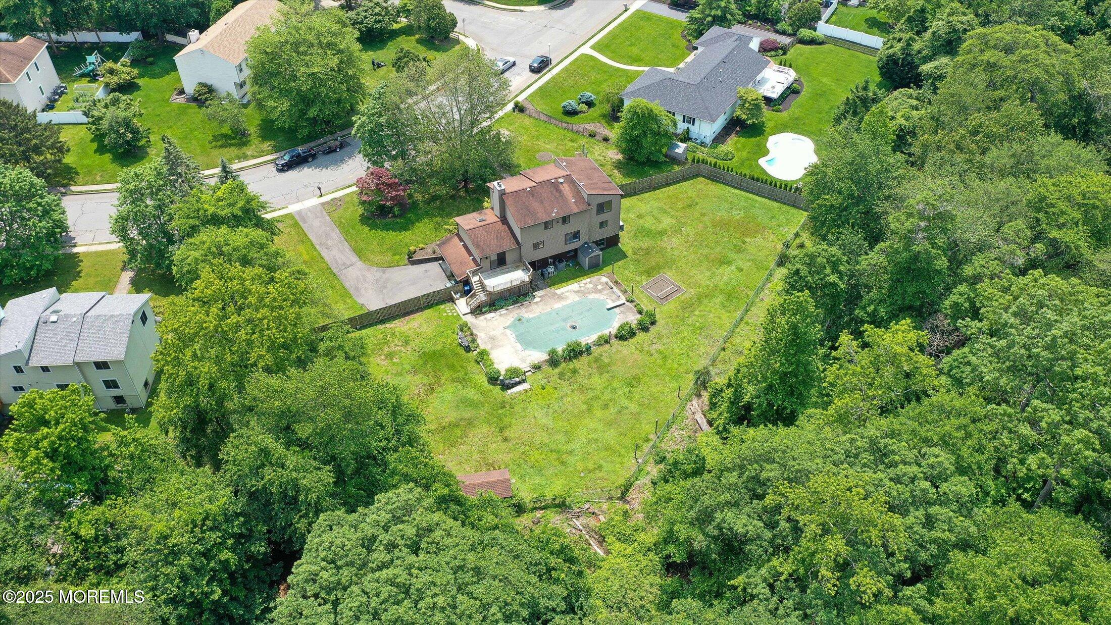 19 Northwoods Road Asbury Park, NJ 07712 - Photo 67 of 79 an aerial view of residential house with swimming pool outdoor seating and yard