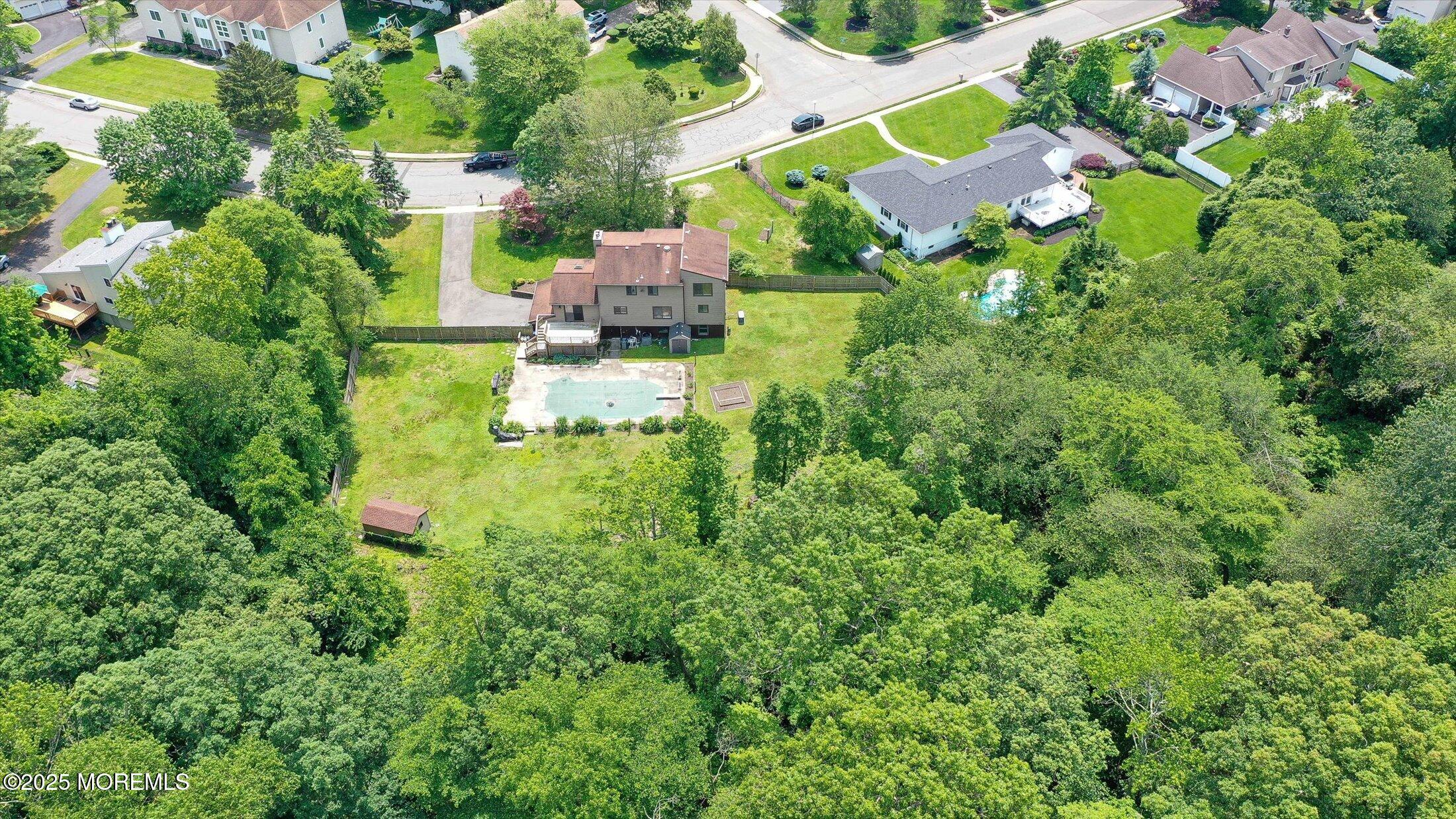 19 Northwoods Road Asbury Park, NJ 07712 - Photo 71 of 79 an aerial view of residential houses with outdoor space and trees all around