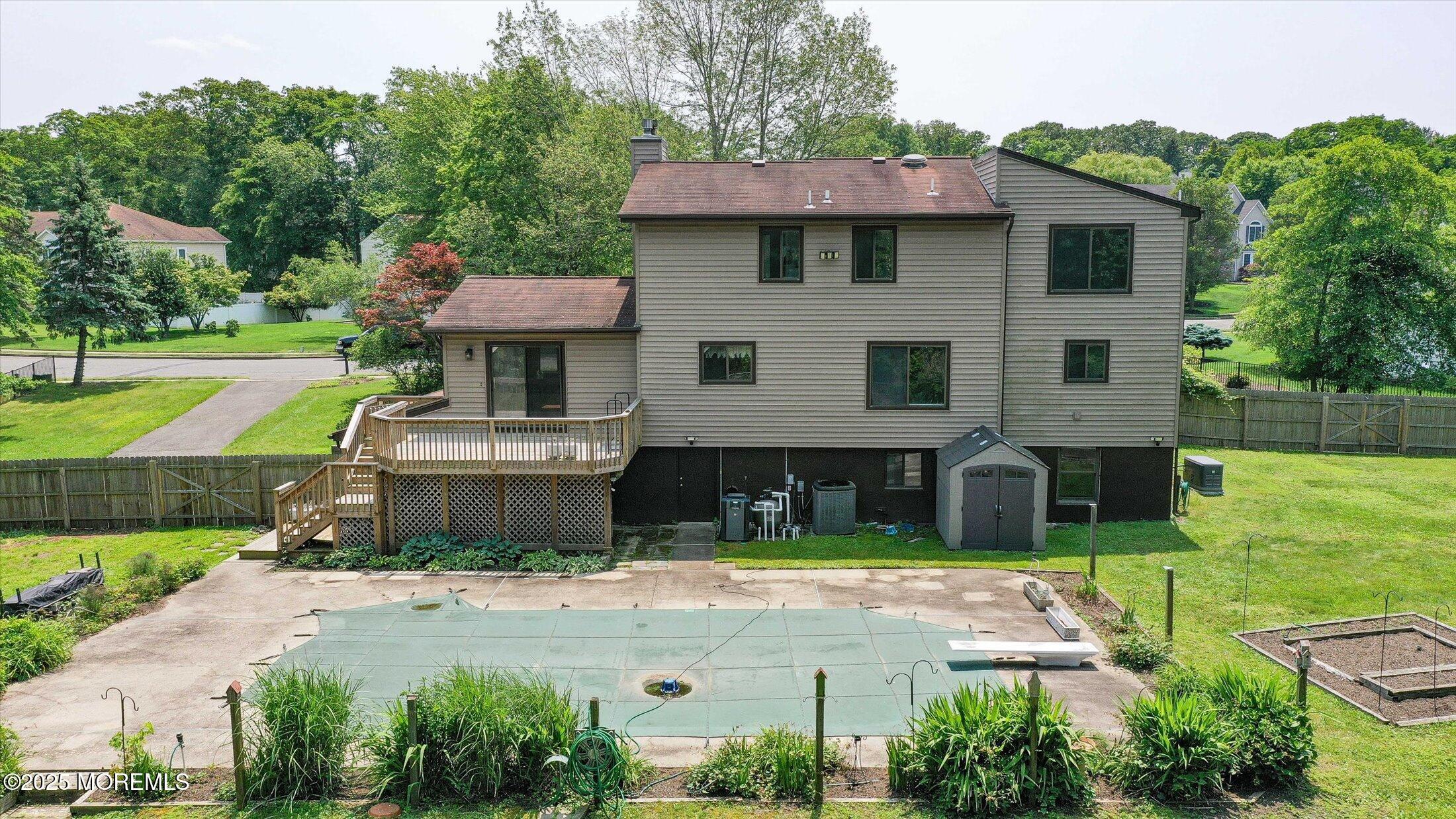 19 Northwoods Road Asbury Park, NJ 07712 - Photo 76 of 79 a front view of a house with a yard