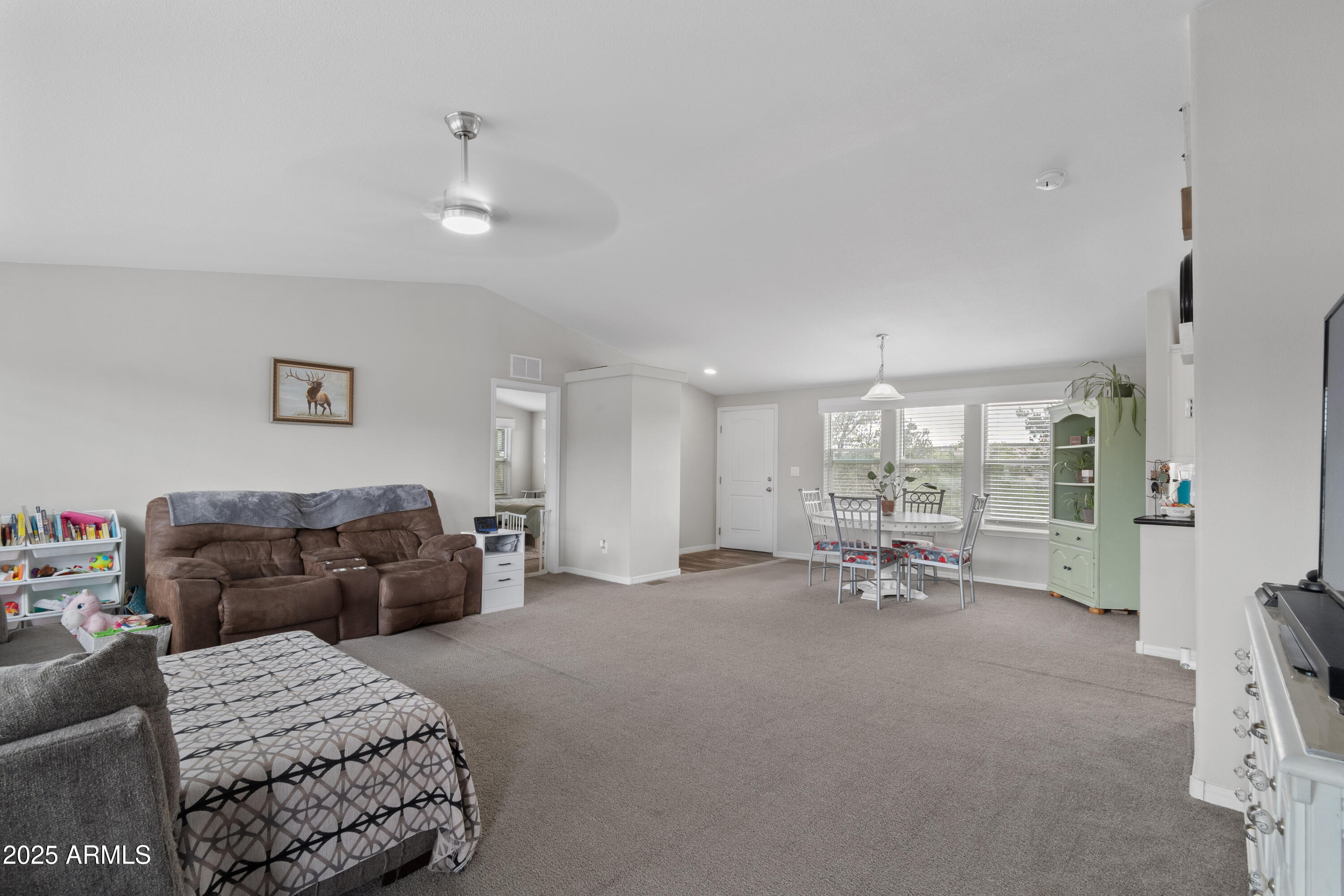 65 Co Road Show Low, AZ 85901 - Photo 12 of 38 a living room with furniture and a large window