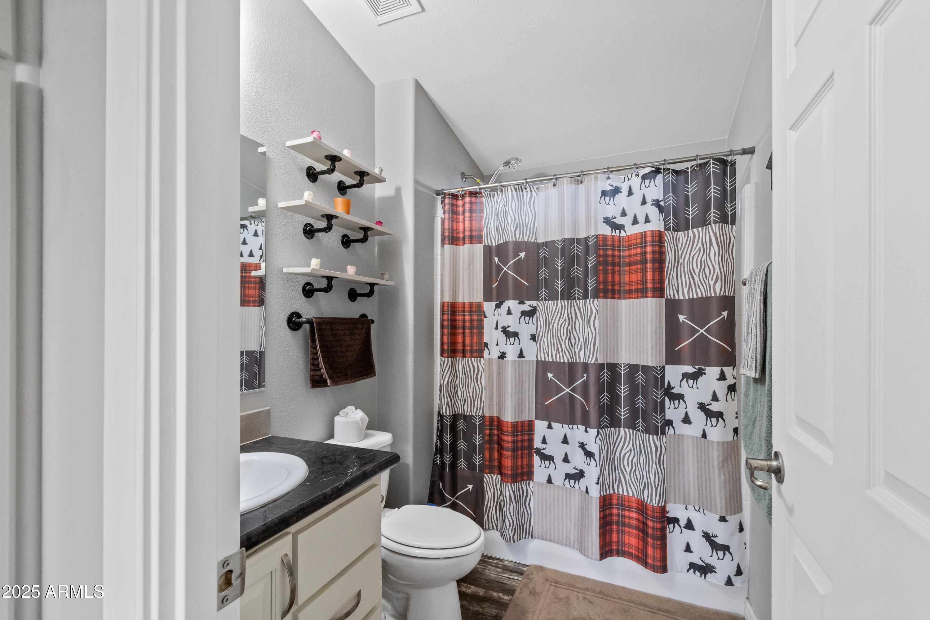 65 Co Road Show Low, AZ 85901 - Photo 14 of 38 a bathroom with a toilet sink and shower curtain