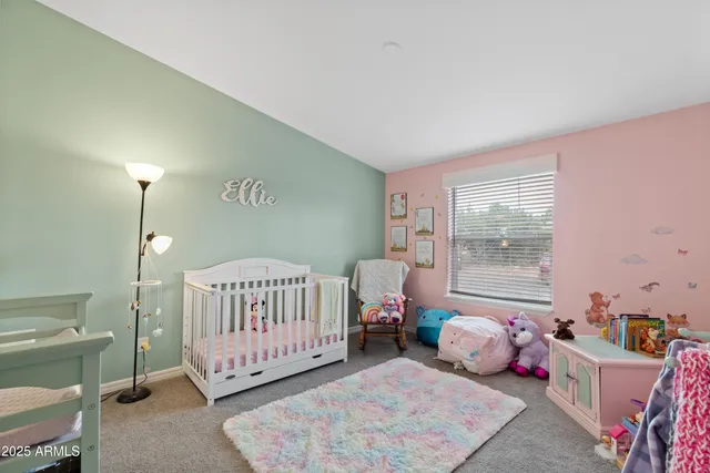 a bathroom with a toilet sink and shower curtain