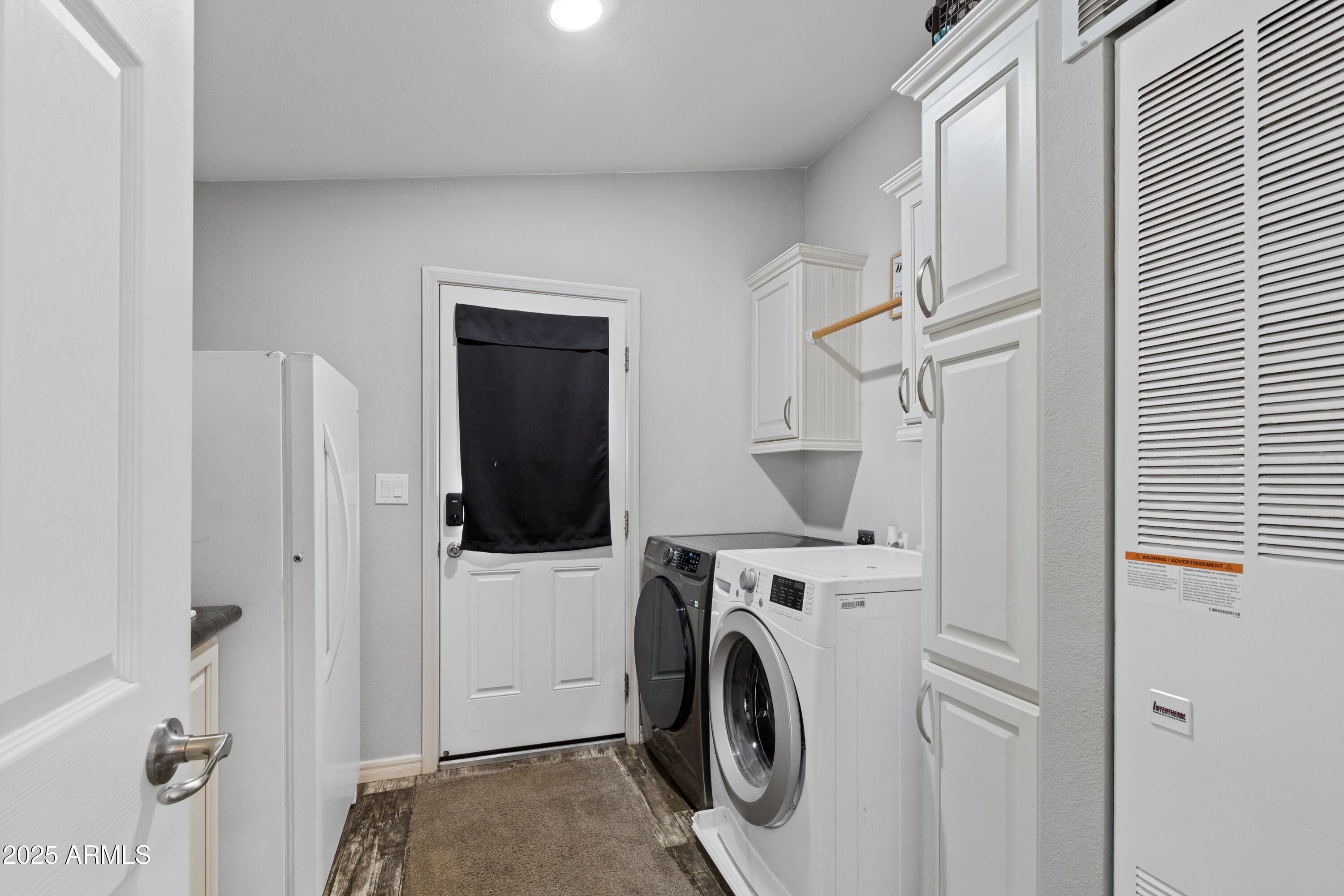 65 Co Road Show Low, AZ 85901 - Photo 17 of 38 a view of a storage and utility room with washer and dryer