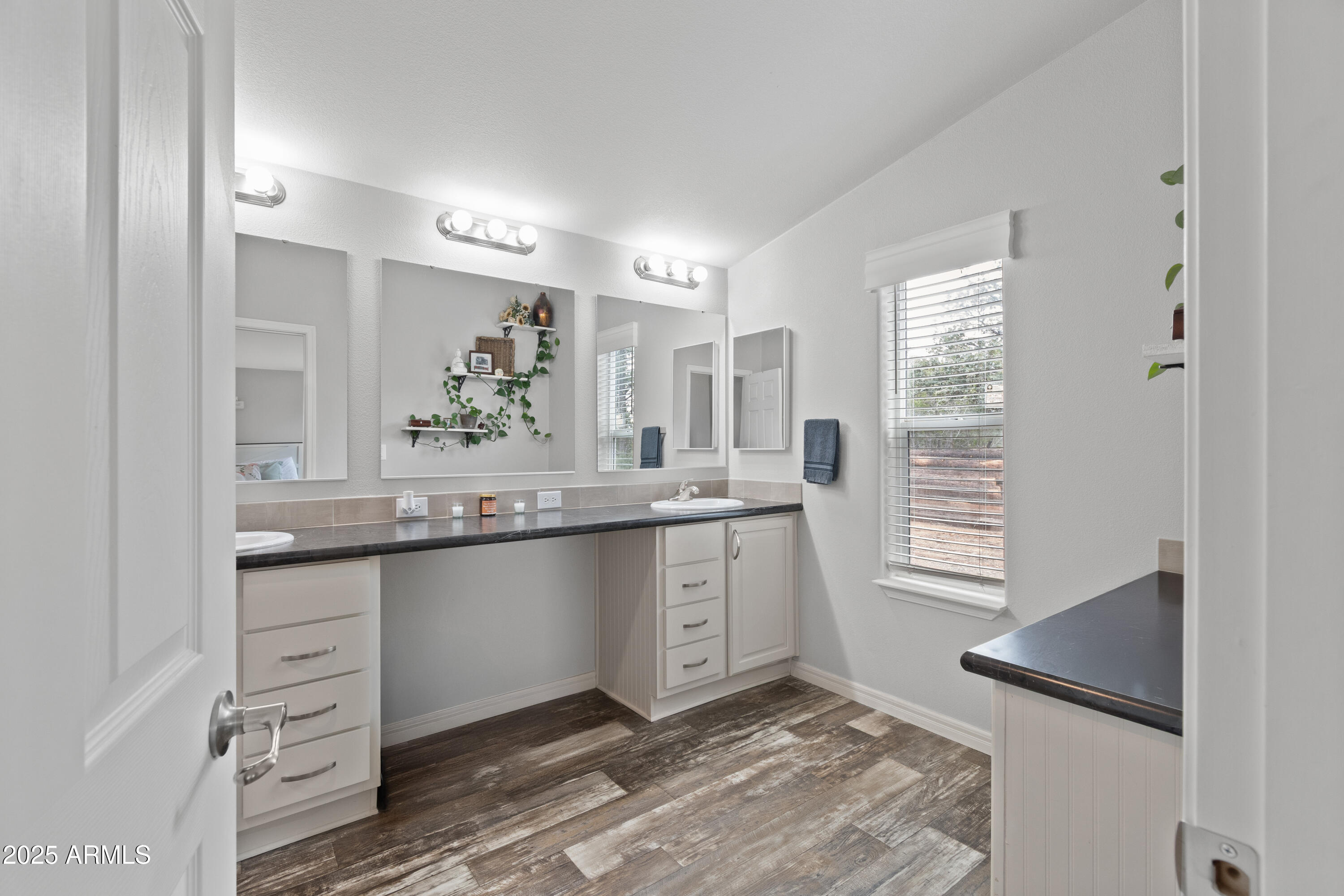 65 Co Road Show Low, AZ 85901 - Photo 4 of 38 a spacious bathroom with a granite countertop sink a mirror and a