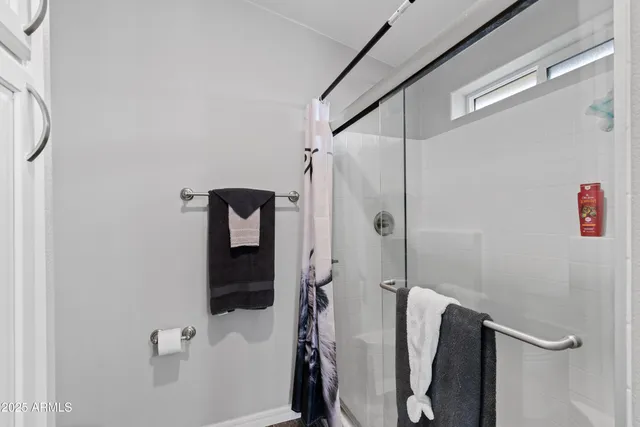 a spacious bathroom with a granite countertop sink mirror and double