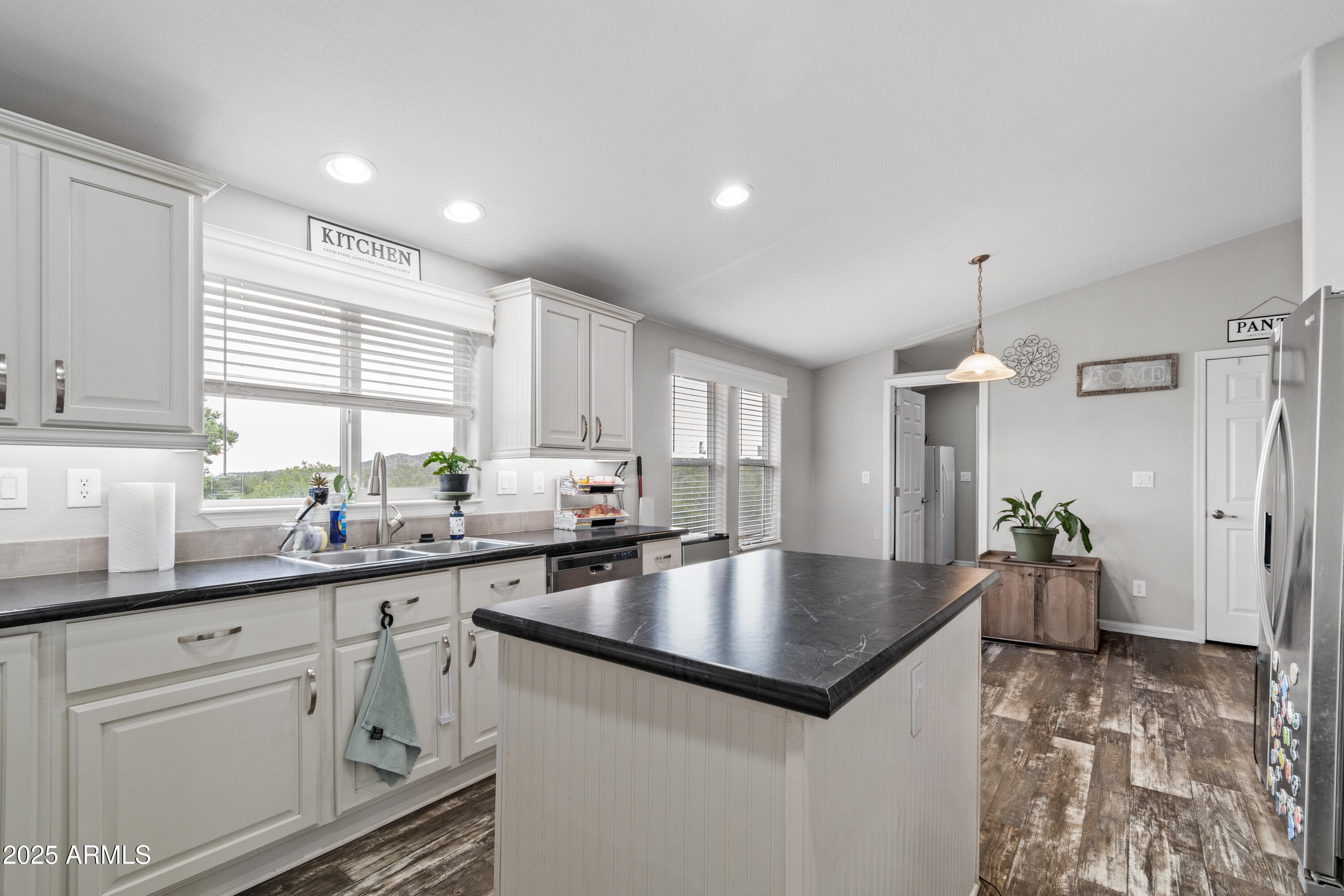 65 Co Road Show Low, AZ 85901 - Photo 7 of 38 a kitchen with granite countertop a sink dishwasher stove and cabinets with wooden floor