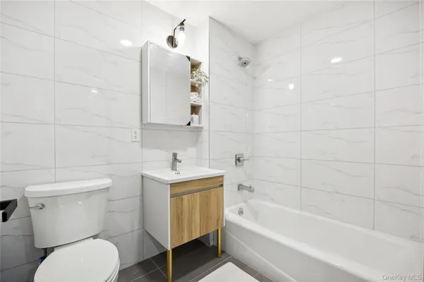 a bathroom with a toilet sink and bathtub