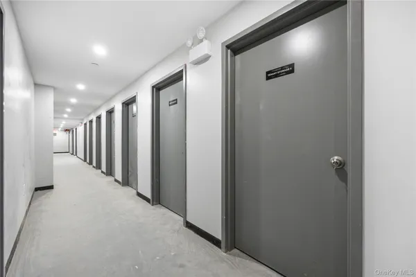 a utility room with stainless steel appliances washer and dryer