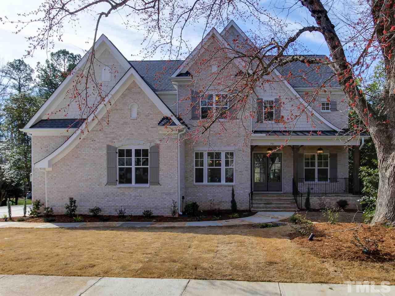 701 Shelley Road Raleigh, NC 27609 - Photo 1 of 25 a front view of a house with garden