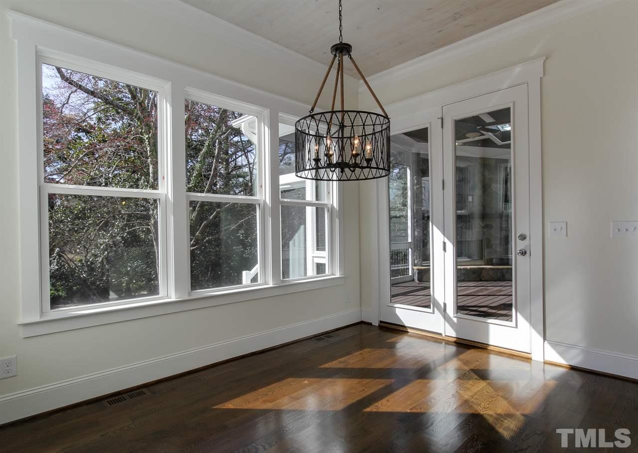 701 Shelley Road Raleigh, NC 27609 - Photo 12 of 25 a view of empty room with wooden floor and fan