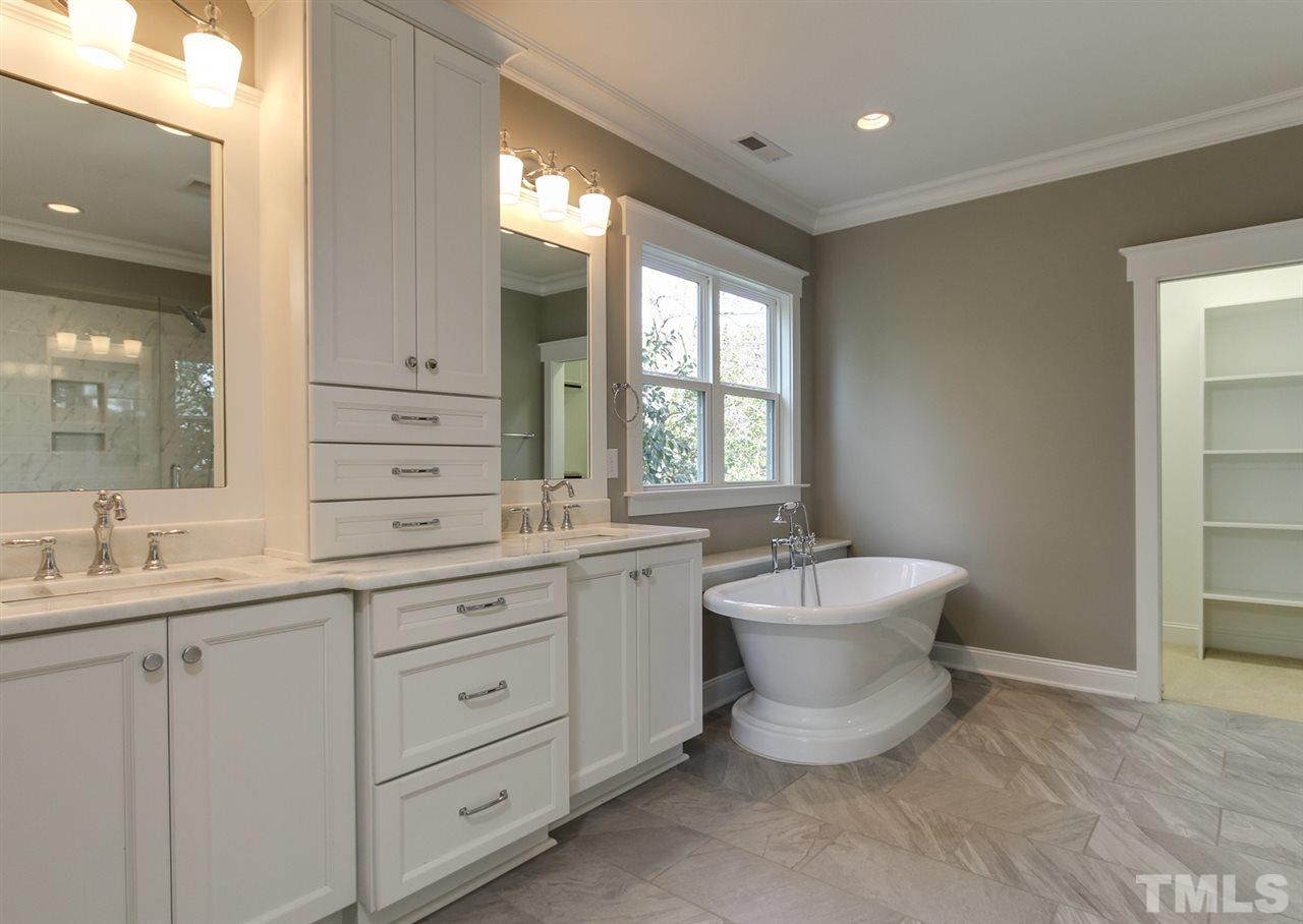 701 Shelley Road Raleigh, NC 27609 - Photo 18 of 25 a bathroom with a double vanity sink mirror and bathtub