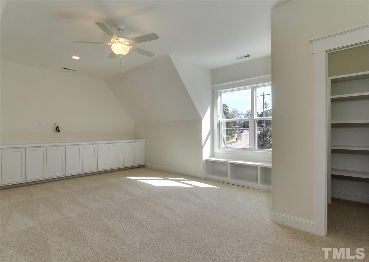 701 Shelley Road Raleigh, NC 27609 - Photo 20 of 25 an empty room with windows and fan