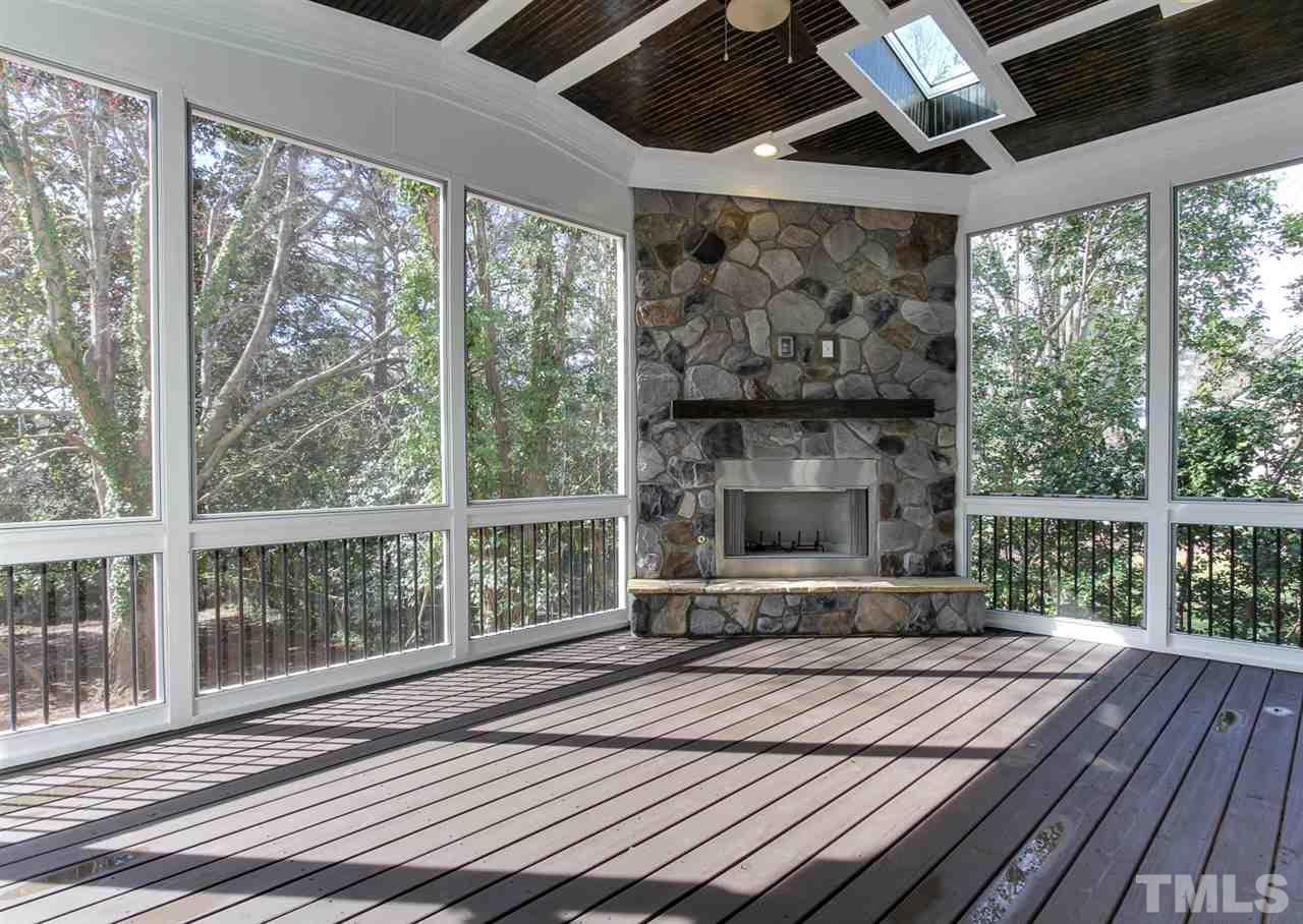 701 Shelley Road Raleigh, NC 27609 - Photo 24 of 25 a bedroom with a bed and a large window