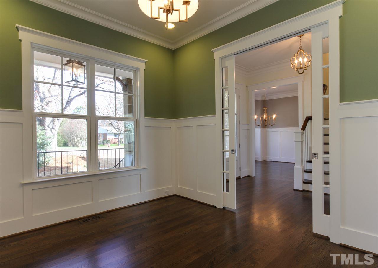 701 Shelley Road Raleigh, NC 27609 - Photo 4 of 25 wooden floor in an empty room with a window