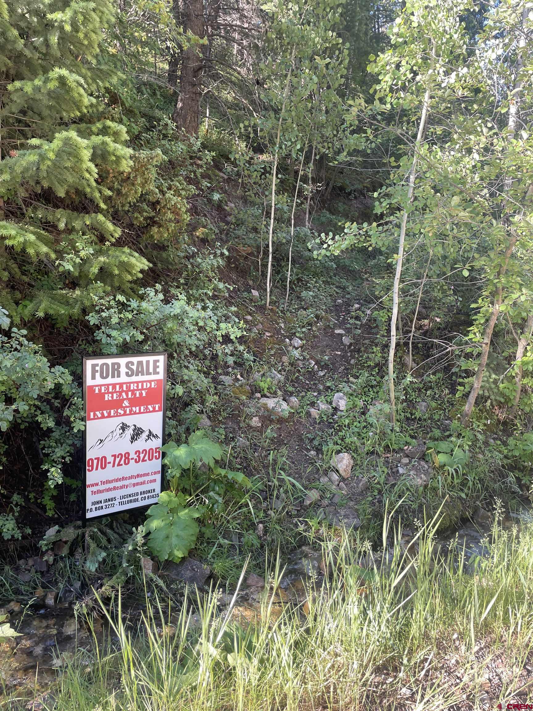 58p 58P Road Placerville, CO 81430 - Photo 30 of 34 a sign that is sitting in a forest