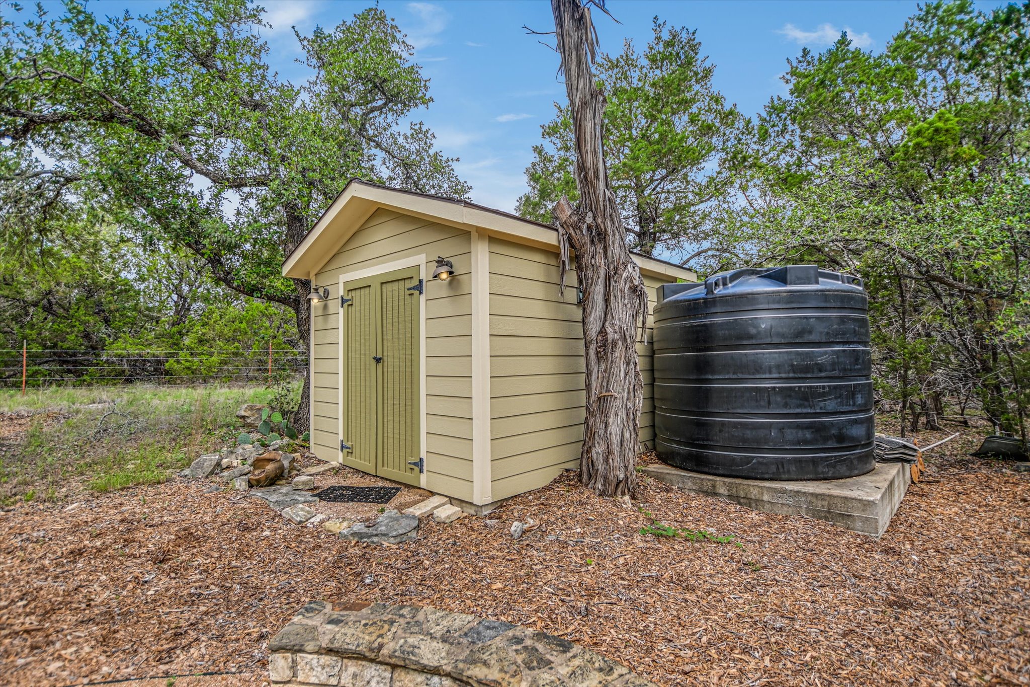 590 Rancho Grande Drive Wimberley, TX 78676 - Photo 28 of 30 a house view with a backyard space