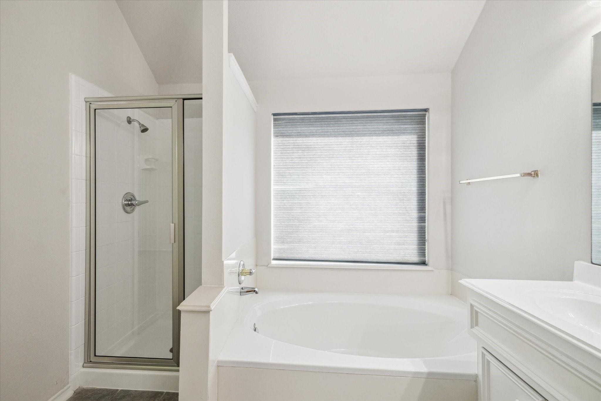 8211 Broken Timber Way Houston, TX 77095 - Photo 11 of 15 a white bath tub sitting next to a white sink