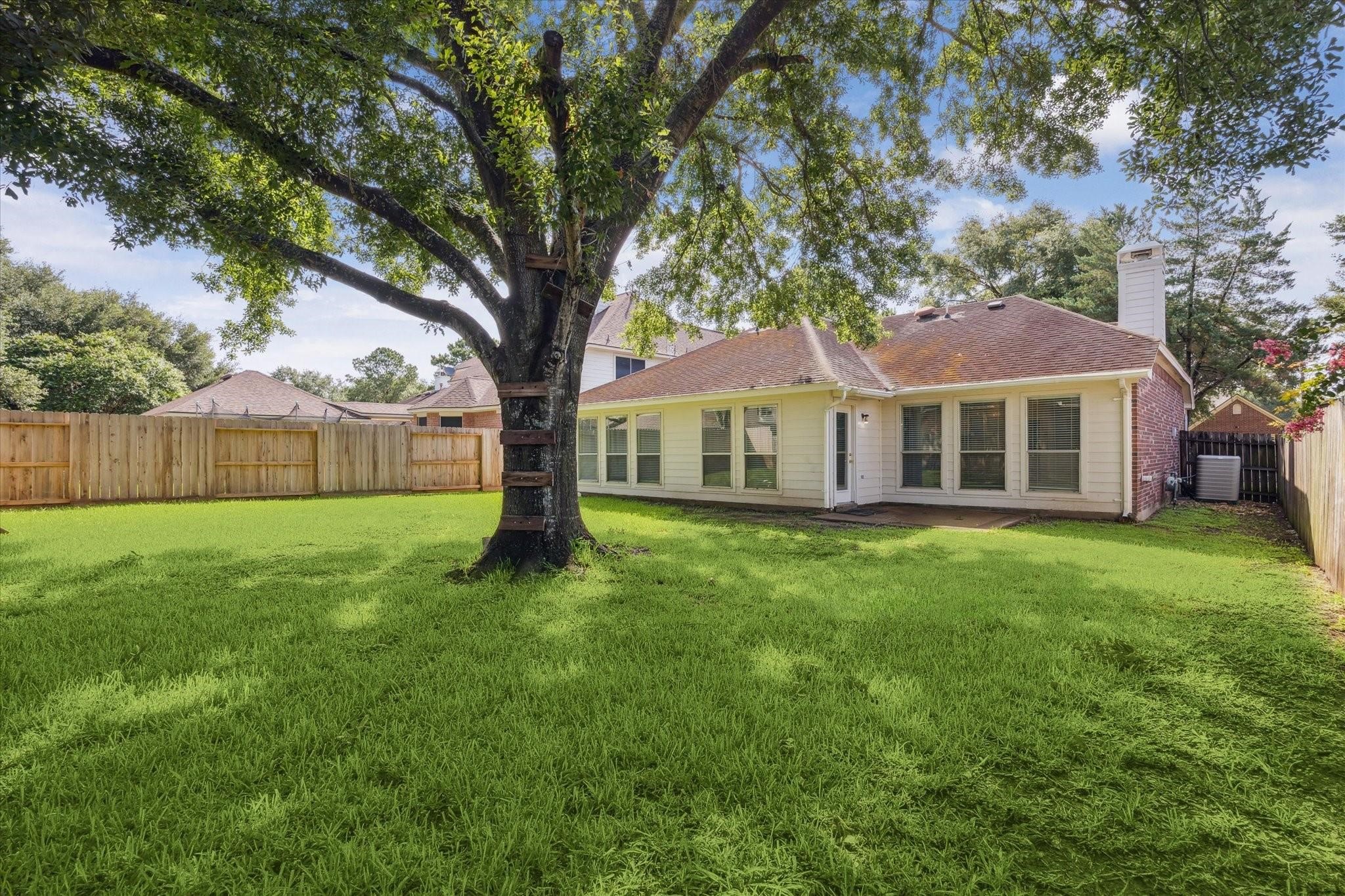 8211 Broken Timber Way Houston, TX 77095 - Photo 14 of 15 a front view of a house with a garden