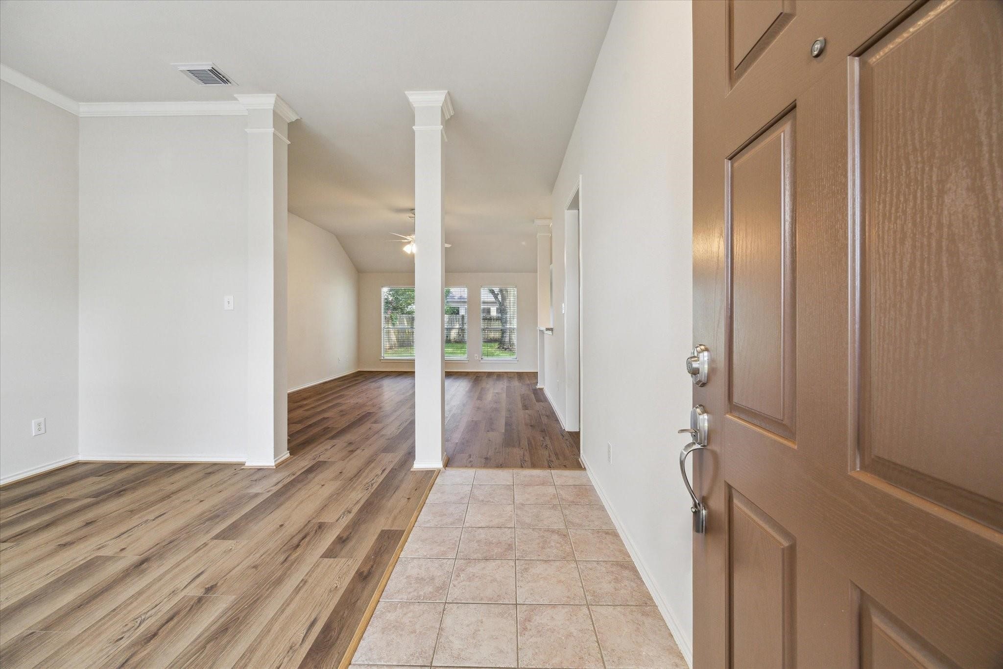 8211 Broken Timber Way Houston, TX 77095 - Photo 2 of 15 a view of a hallway with wooden floor