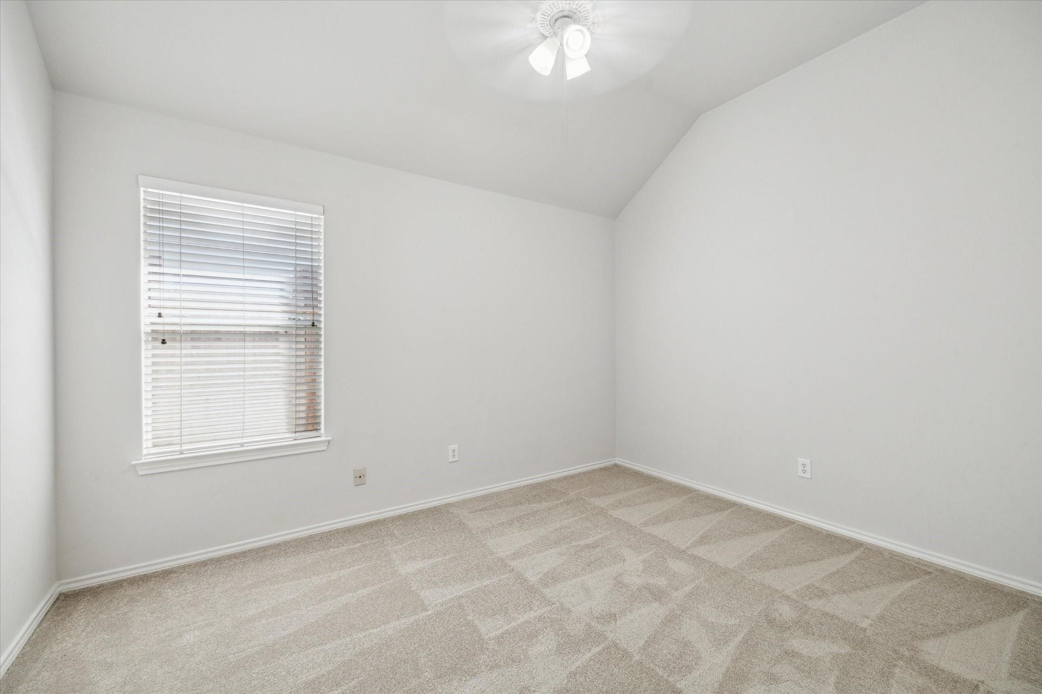 8211 Broken Timber Way Houston, TX 77095 - Photo 4 of 15 an empty room with a window