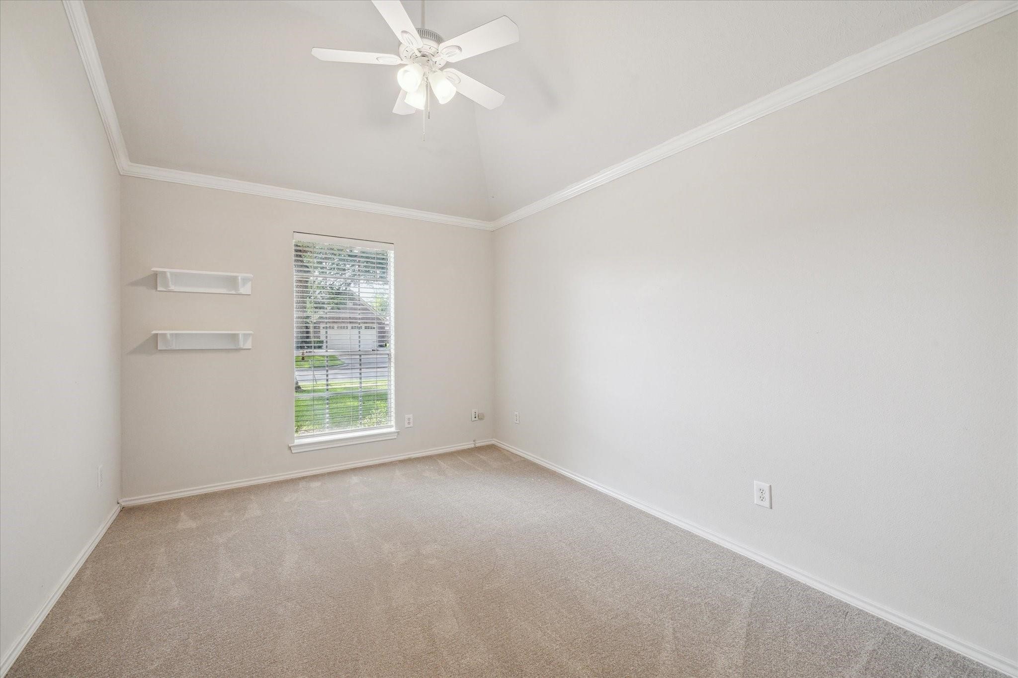 8211 Broken Timber Way Houston, TX 77095 - Photo 10 of 15 an empty room with a window and a fan