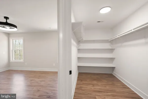 a bathroom with a double vanity sink and mirror