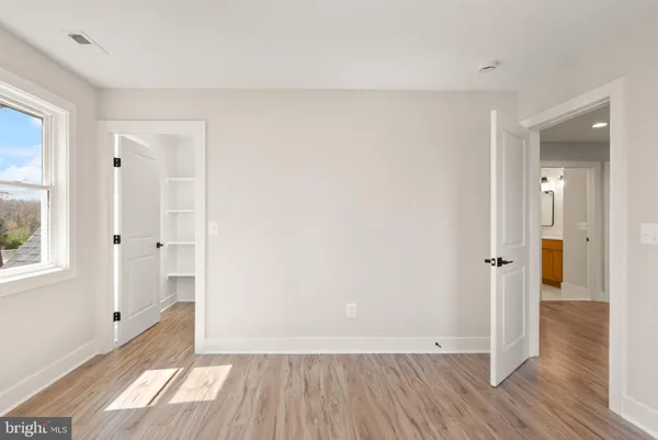 a bathroom with a glass shower door