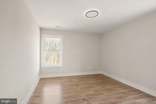 a view of a bathroom from a hallway