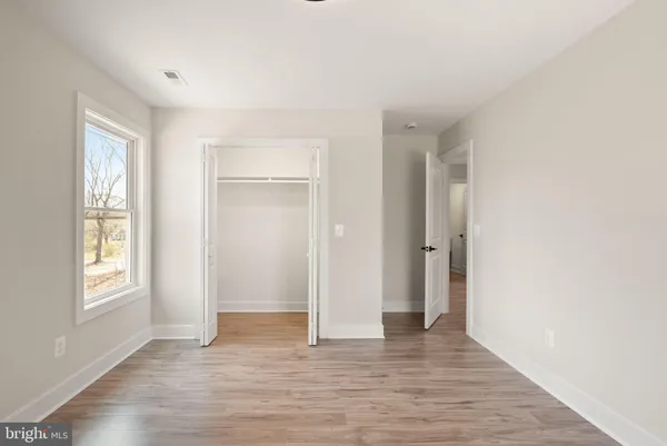a view of a balcony with wooden floor